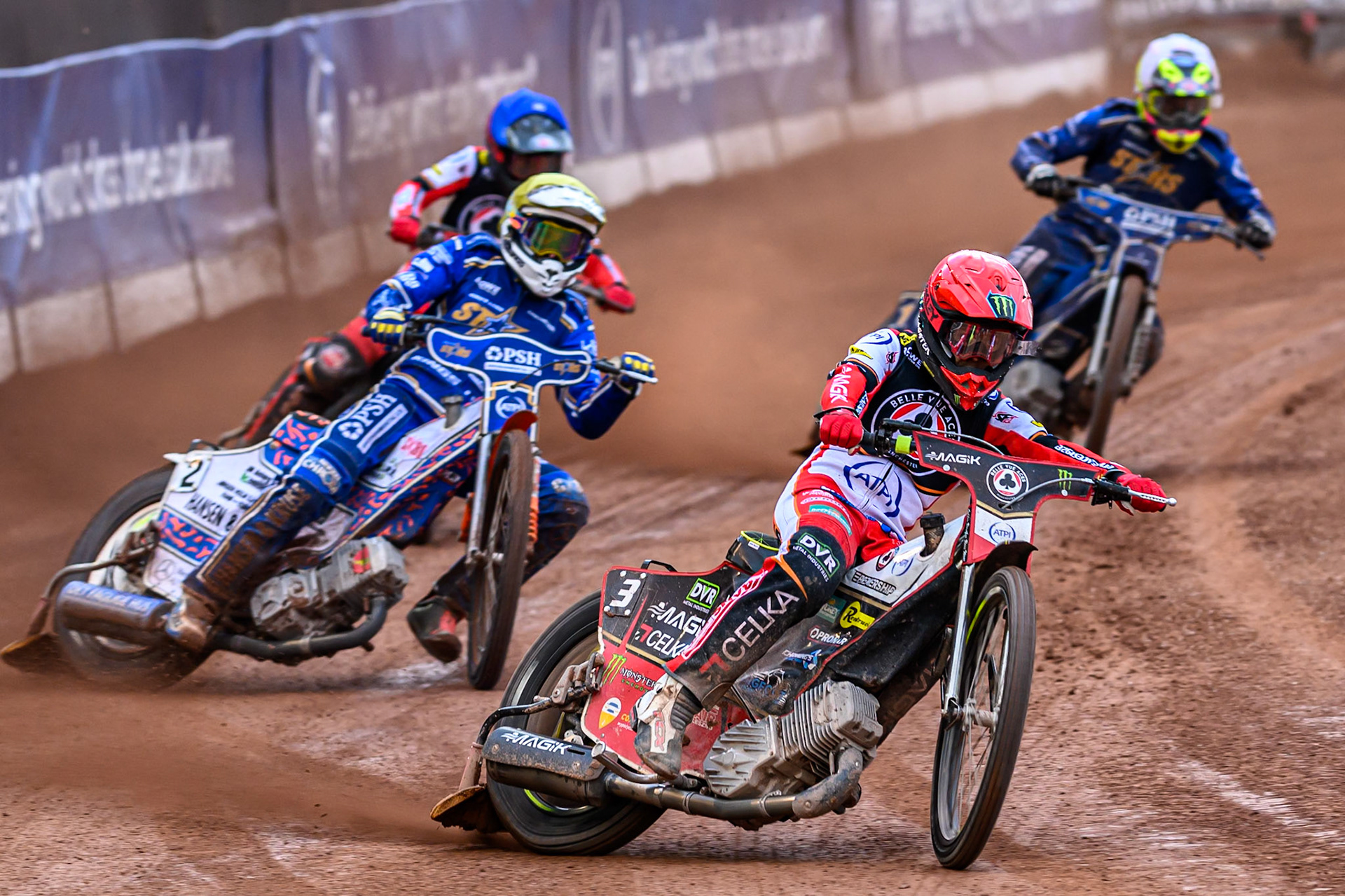 Belle Vue Aces' Jaimon Lidsey in Red leading Kings Lynn Stars' Niels-Kristian Iversen in Yellow Belle Vue Aces' Zach Cook in Blue and Kings Lynn Stars' Richard Lawson in White during the Rowe Motor Oil Premiership match between Belle Vue Aces and King's Lynn Stars at the National Speedway Stadium, Manchester on Monday 23rd June 2025. (Photo: Ian Charles | MI News)