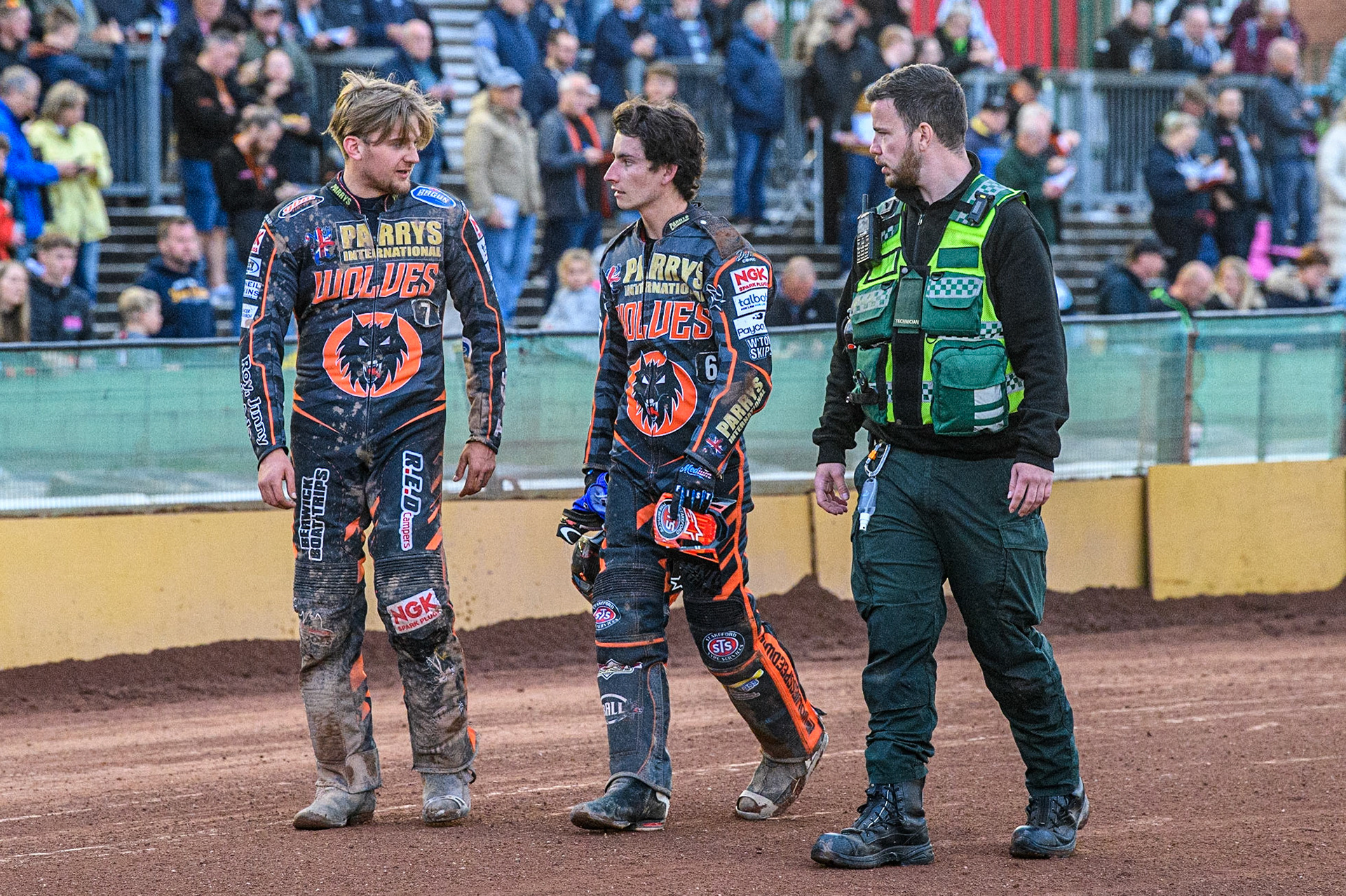 Zach Cook walks back to the pits with (l - r) Leon Flint, Cook, Paramedic during the Sports Insure Premiership match between Wolverhampton Wolves and Belle Vue Aces at Monmore Green Stadium, Wolverhampton on Monday 10th July 2023. (Photo: Ian Charles | MI News)