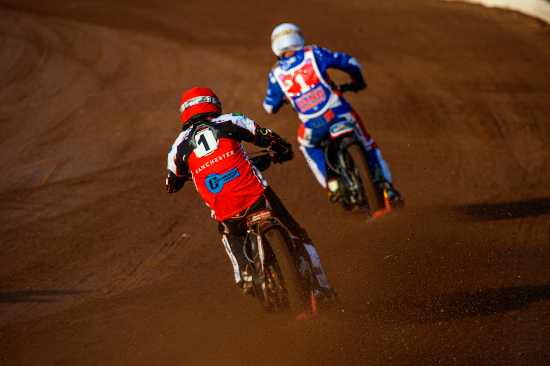 MANCHESTER, UK. JULY 23RD Jack Smith  (Red) chases Jake Knight (White) during the National Development League match between Belle Vue Colts and Eastbourne Seagulls at the National Speedway Stadium, Manchester on Friday 23rd July 2021. (Credit: Ian Charles | MI News)