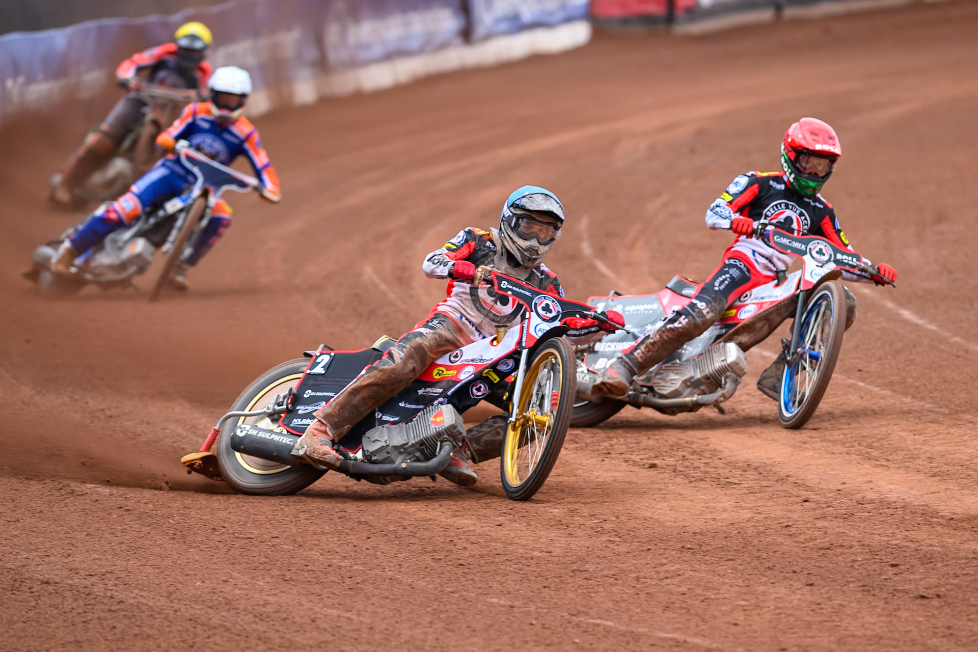 Norick Blödorn of Belle Vue Aces in Blue and team mate Brady Kurtz of Belle Vue Aces in Red leading Nicolai Klindt of Northampton Foxes in White and Kye Thomson of Northampton Foxes in Yellow during the Rowe Motor Oil Premiership match between Belle Vue Aces and Northampton Foxes at the National Speedway Stadium, Manchester on Monday 4th May 2026. (Photo: Ian Charles | MI News)