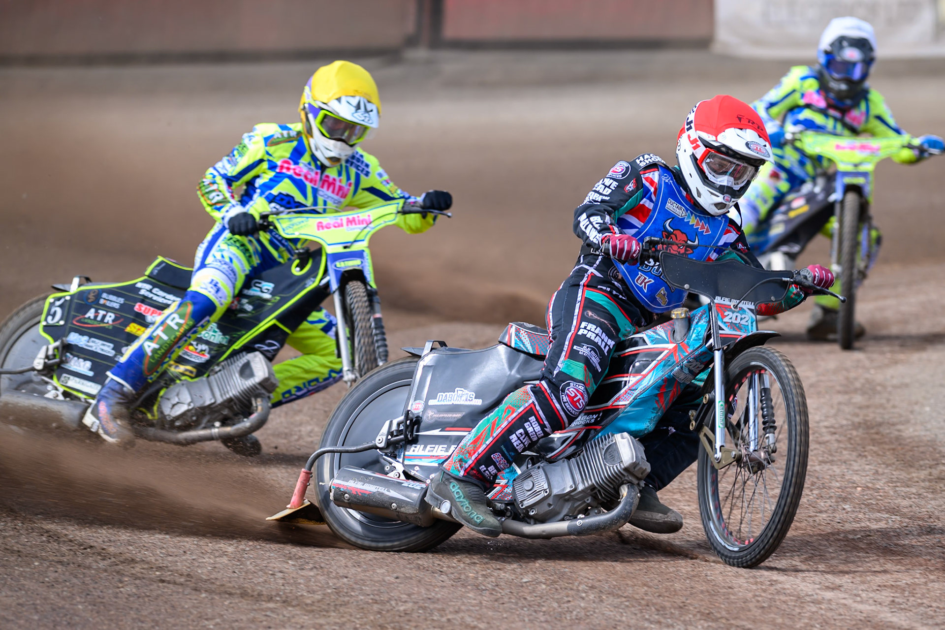 Alfie Bowtell of Buxton Bulls in Red leading Darryl Ritchings of Oxford Chargers in Yellow and Jody Scott of Oxford Chargers in White during the WSRA National Development League match between Buxton Bulls and Oxford Chargers at Hi-Edge Speedway, Buxton on Sunday 2nd August 2026. (Photo: Ian Charles | MI News)