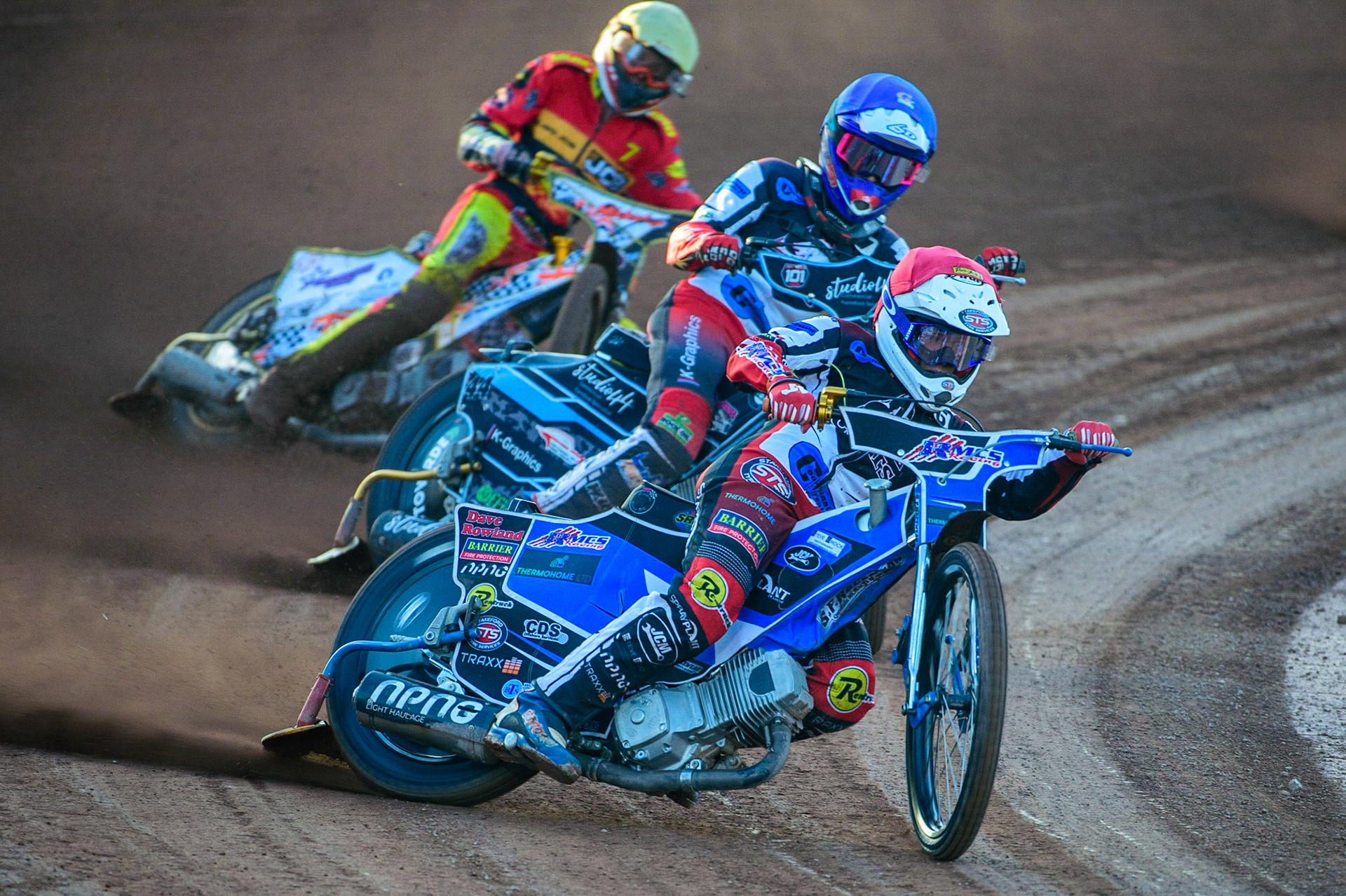 Archie Freeman  (Red) and Freddy Hodder (Blue) lead Mickie Simpson  (Yellow) during the National Development League match between Belle Vue Aces and Leicester Lions at the National Speedway Stadium, Manchester on Friday 19th August 2022. (Credit: Ian Charles | MI News)