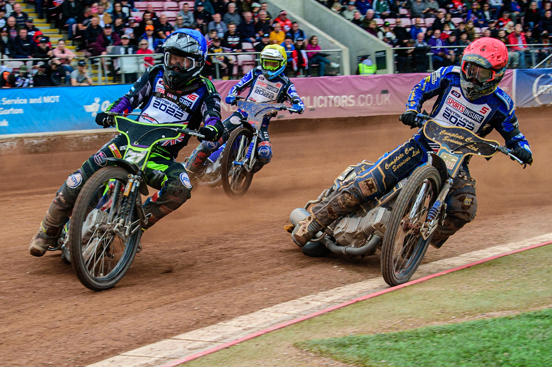 Tom Brennan  (Blue) outside Kyle Howarth  (Red) with Adam Ellis  (Yellow) behind during the Sports Insure British Speedway Final, at the National Speedway Stadium, Manchester, on Sunday 18th September 2022. (Credit: Ian Charles | MI News )