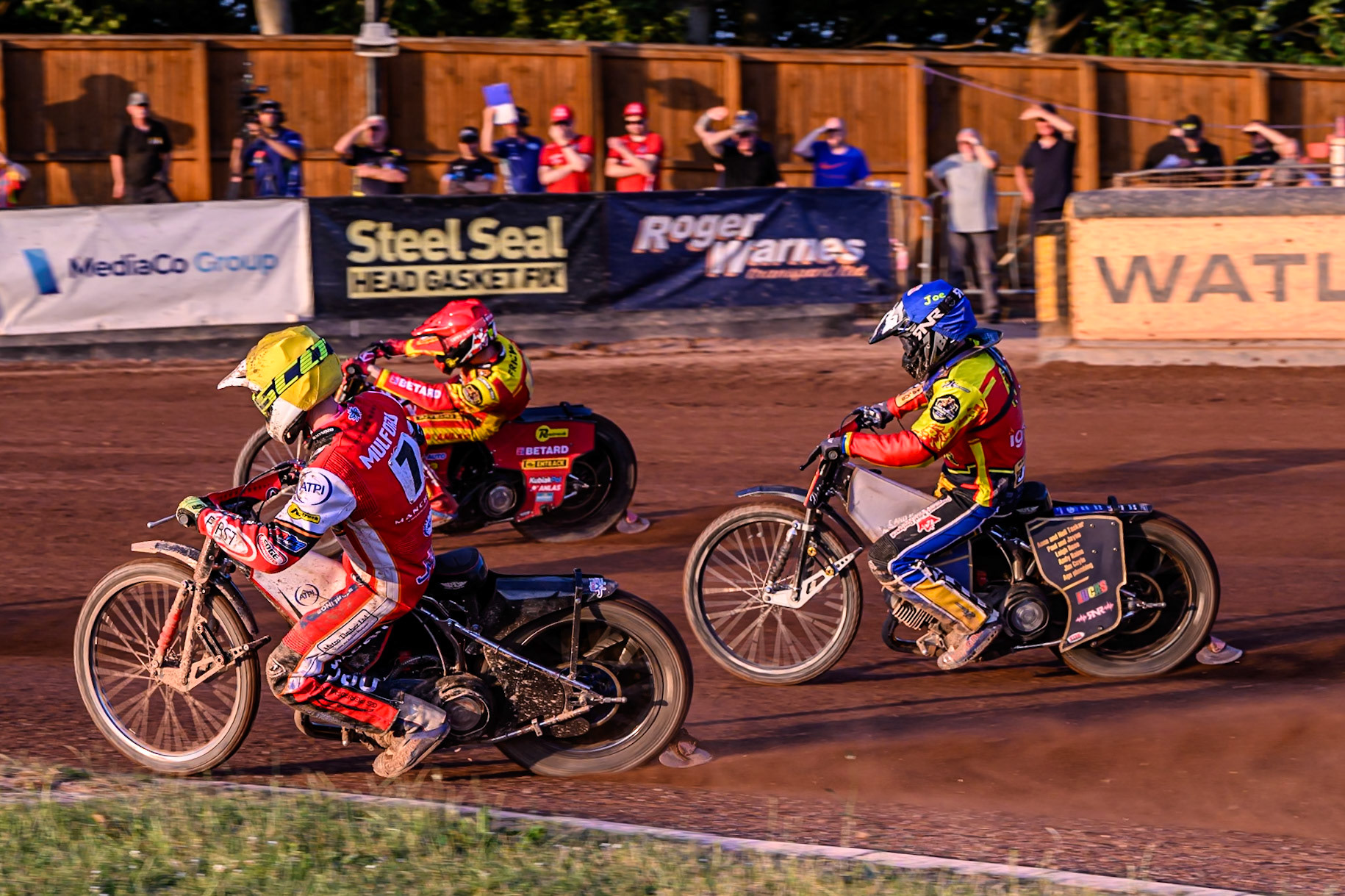 Belle Vue Aces' Jake Mulford in Yellow rides inside Leicester Lions' Max Fricke in Red and Leicester Lions' Joe Thompson in Blue during the Rowe Motor Oil Premiership match between Leicester Lions and Belle Vue Aces at the Hydroscand Arena, Leicester on Thursday 19th June 2025. (Photo: Ian Charles | MI News)