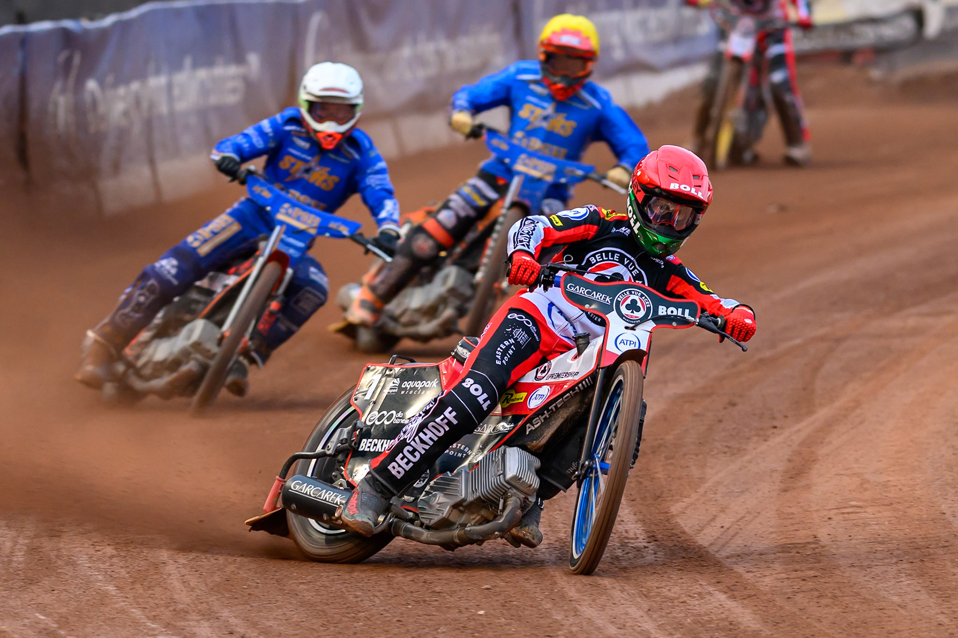 Brady Kurtz of Belle Vue Aces in Red leading Jan Kvech of Kings Lynn Stars in White and Jordan Jenkins of Kings Lynn Stars in Yellow during the Rowe Motor Oil Premiership match between Belle Vue Aces and King's Lynn Stars at the National Speedway Stadium, Manchester on Monday 29th June 2026. (Photo: Ian Charles | MI News)