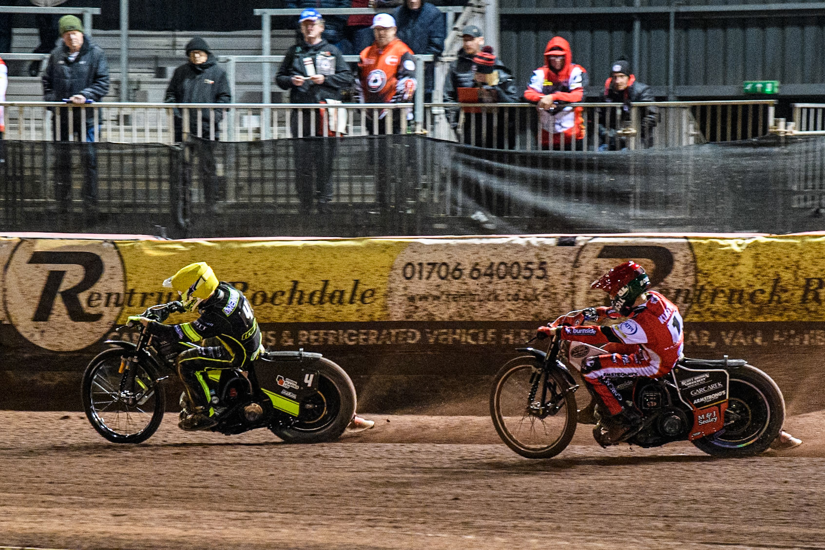 Tom Brennan of Ipswich Witches in Yellow leading Brady Kurtz of Belle Vue Aces in Red during the Premiership Cup Quarter Final 1st Leg match between Belle Vue Aces and Ipswich Witches at the National Speedway Stadium, Manchester on Monday 24th March 2025. (Photo: Ian Charles | MI News)