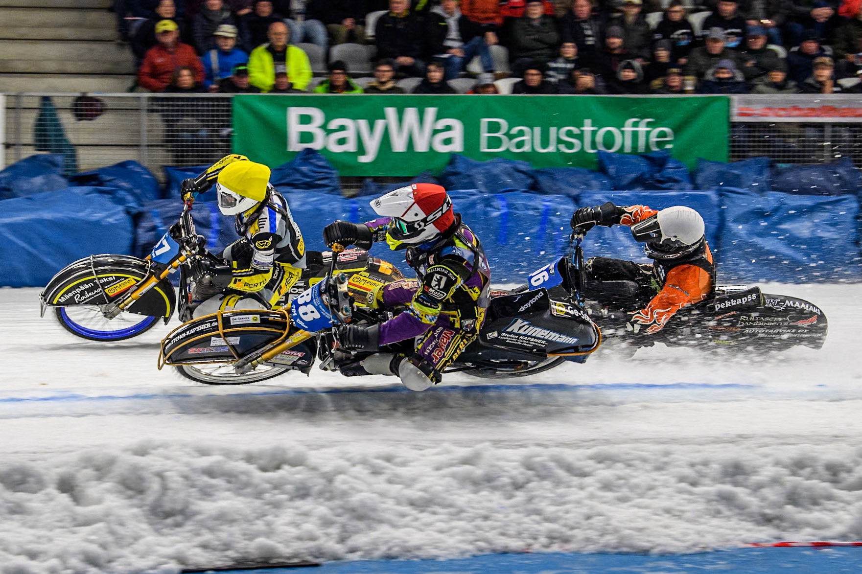The Re-Run of the final, as Germany's Max Niedermaier (88) (Red) goes inside Finland's Heikki Huusko (67) \ty\ and Finland's Aki Ala-Riihimäki (66) (White) during the FIM Ice Speedway Gladiators World Championship Final 2 at the Max-Aicher-Arena, Inzell on Sunday 24 March 2024. (Photo: Ian Charles | MI News)