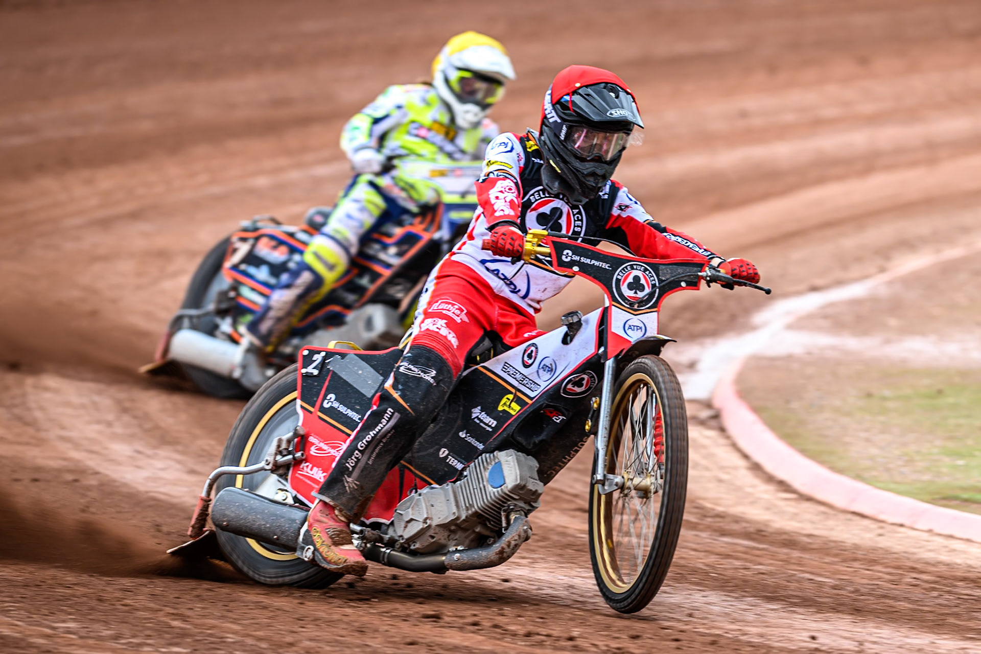 Belle Vue Aces' Norick Blödorn in Red leading Oxford Spires' Luke Killeen in Yellow during the Rowe Motor Oil Premiership match between Belle Vue Aces and Oxford Spires at the National Speedway Stadium, Manchester on Monday 26th May 2025. (Photo: Ian Charles | MI News)