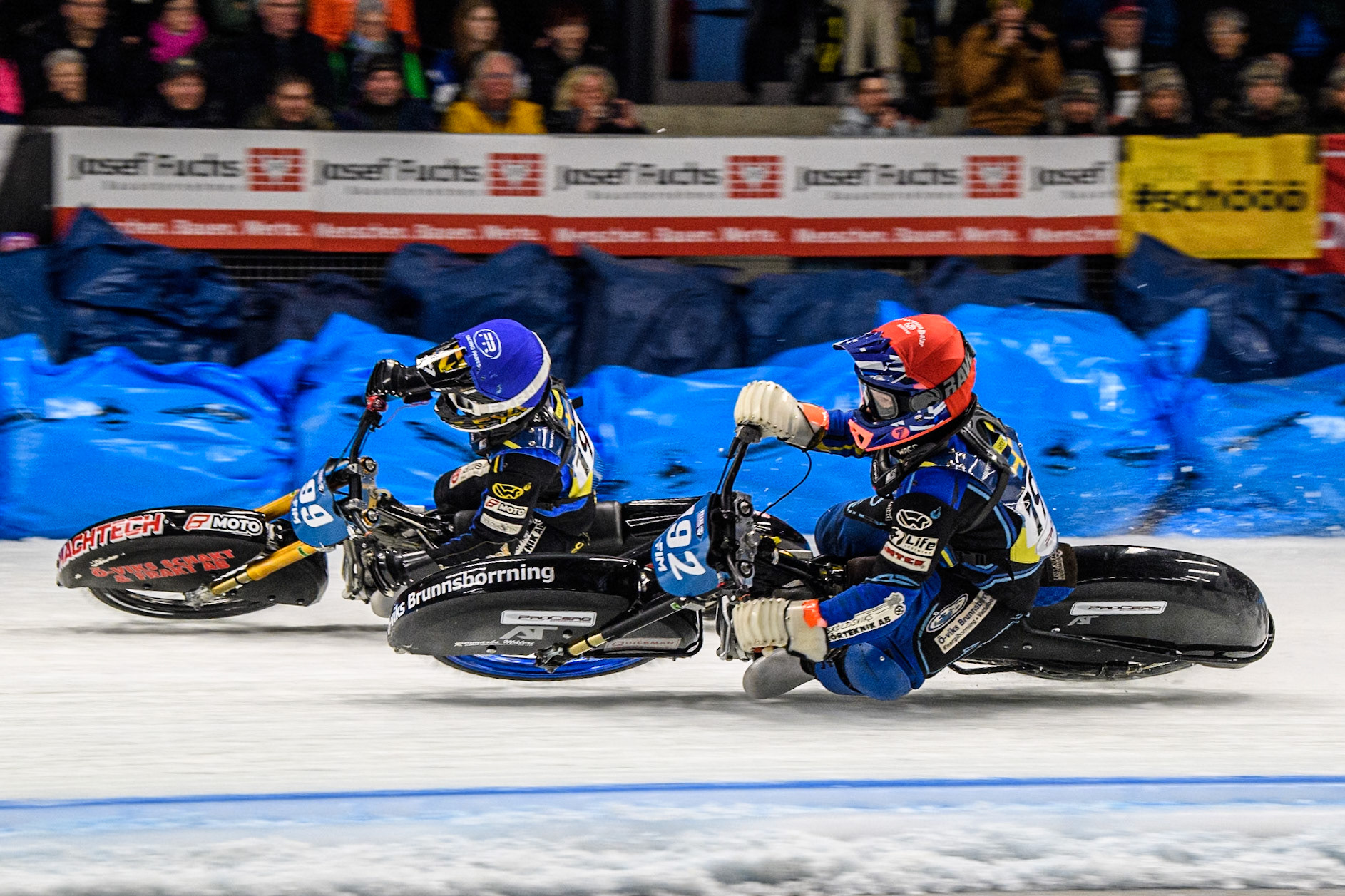 Niclas Svensson (192) of Sweden rides inside Martin Haarahiltunen (199) of Sweden in Blue during the Ice Speedway Gladiators World Championship Final 1 at Max-Aicher-Arena, Inzell on Saturday 15th March 2025. (Photo: Ian Charles | MI News)