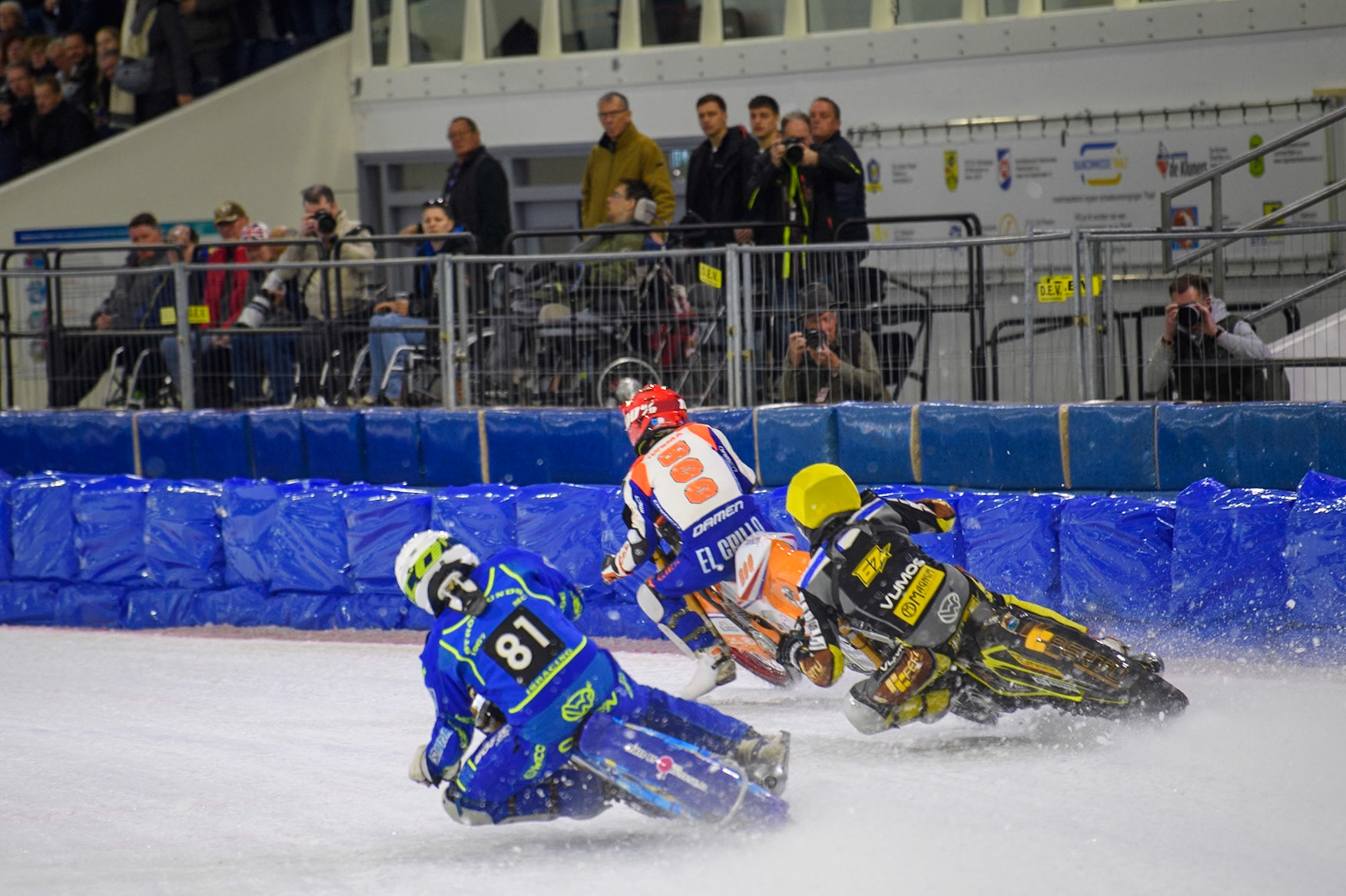 Jimmy Olsén (81) of Sweden in White and Heikki Huusko (67) of Finland in Yellow chases Jasper Iwema (800) of The Netherlands in Red during the FIM Ice Speedway Gladiators World Championship, Final 4 at the Ice Stadium, Thialf, Heerenveen on Sunday 6th April 2025. (Photo: Ian Charles | MI News)