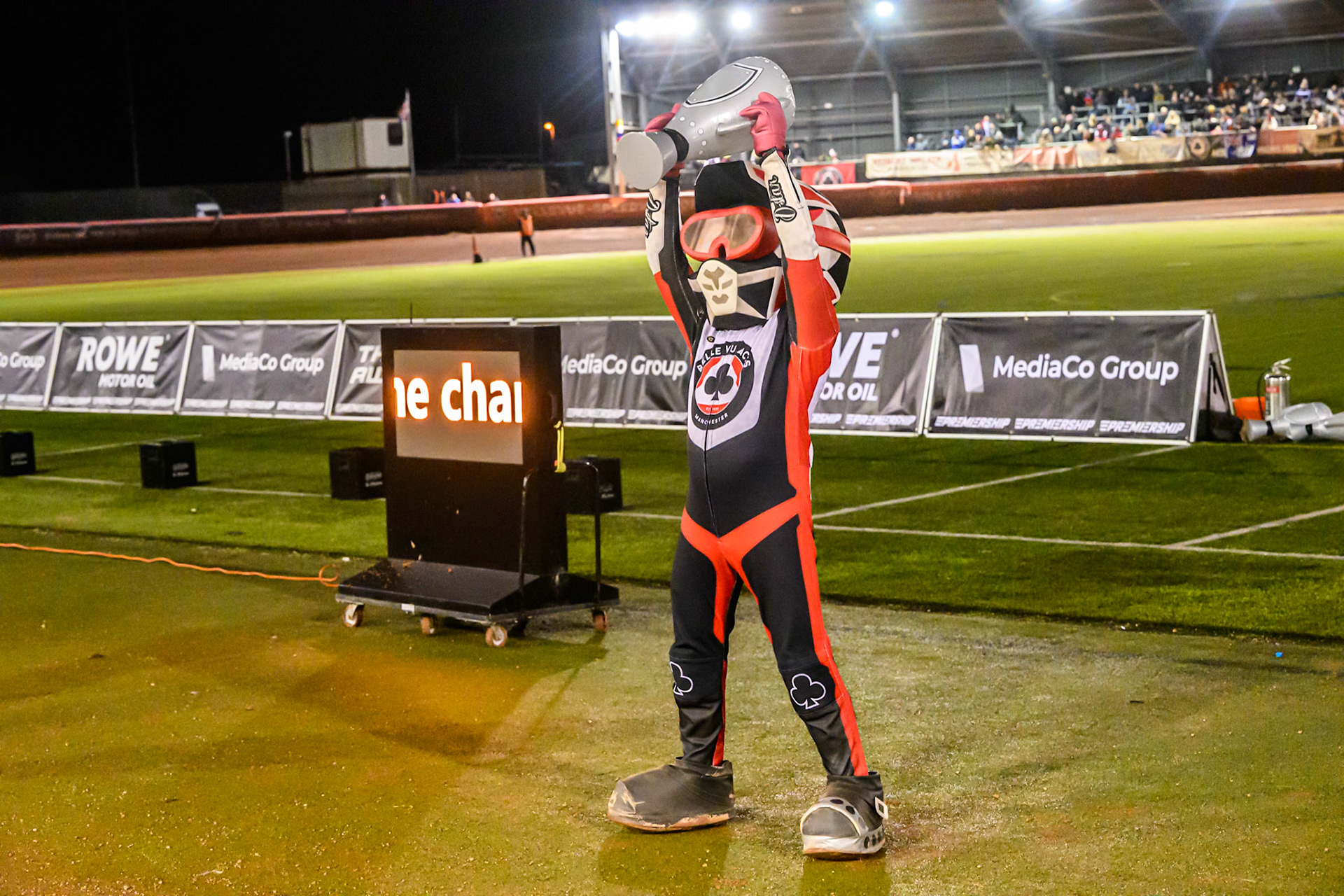 Belle Vue ATPI Aces mascot Chase The Ace celebrates with his inflatable trophy during the Rowe Motor Oil Premiership Grand Final 2nd Leg between Belle Vue Aces and Sheffield Tigers at the National Speedway Stadium, Manchester on Friday 16th October 2026. (Photo: Ian Charles | MI News)