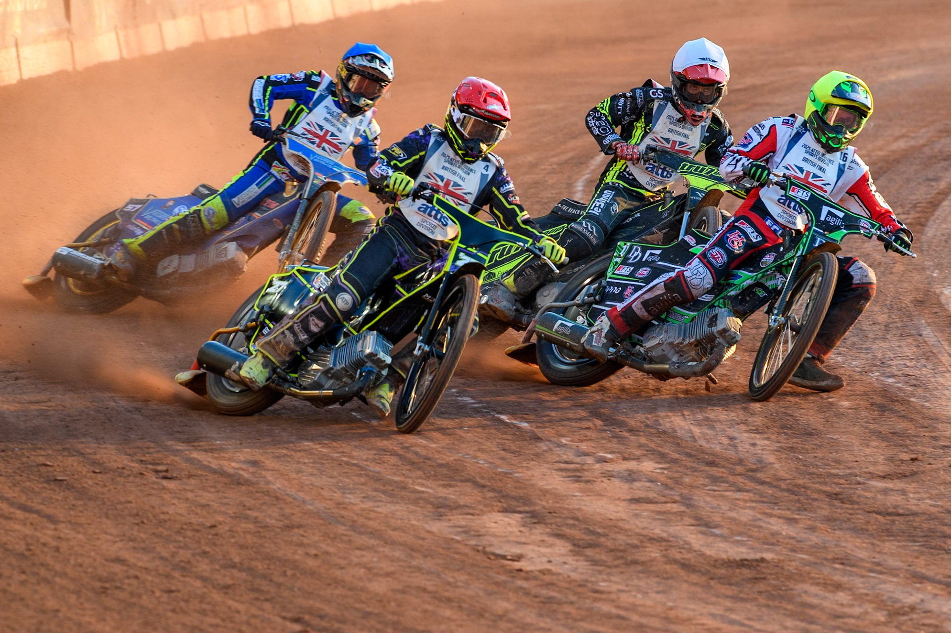 Tom Brennan in Red rides outside Charles Wright in Yellow with Connor Mountain in Blue and Adam Ellis in White behind during the Attis Insurance Sports Division British Final at the National Speedway Stadium, Manchester on Monday 12th May 2025. (Photo: Ian Charles | MI News)