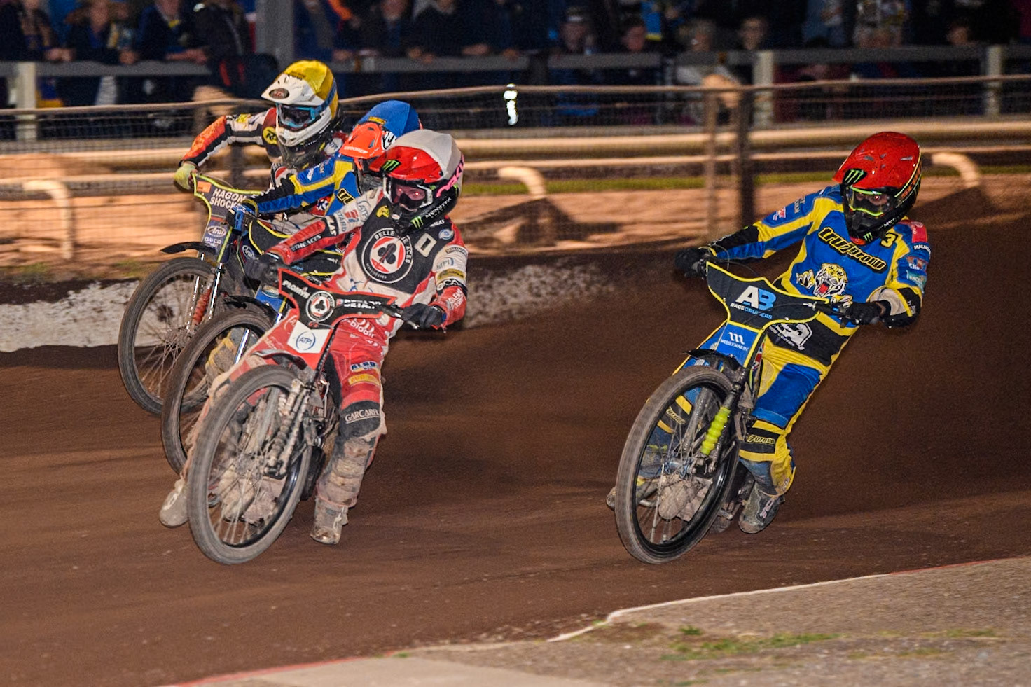 Belle Vue Aces' Dan Bewley   in White leading Sheffield Tigers' Chris Holder  in Red, Sheffield Tigers' Josh Pickering  in Blue and Belle Vue Aces' Jake Mulford   in Yellow during the Rowe Motor Oil Premiership match between Sheffield Tigers and Belle Vue Aces at Owlerton Stadium, Sheffield on Monday 26th August 2024. (Photo: Ian Charles | MI News)