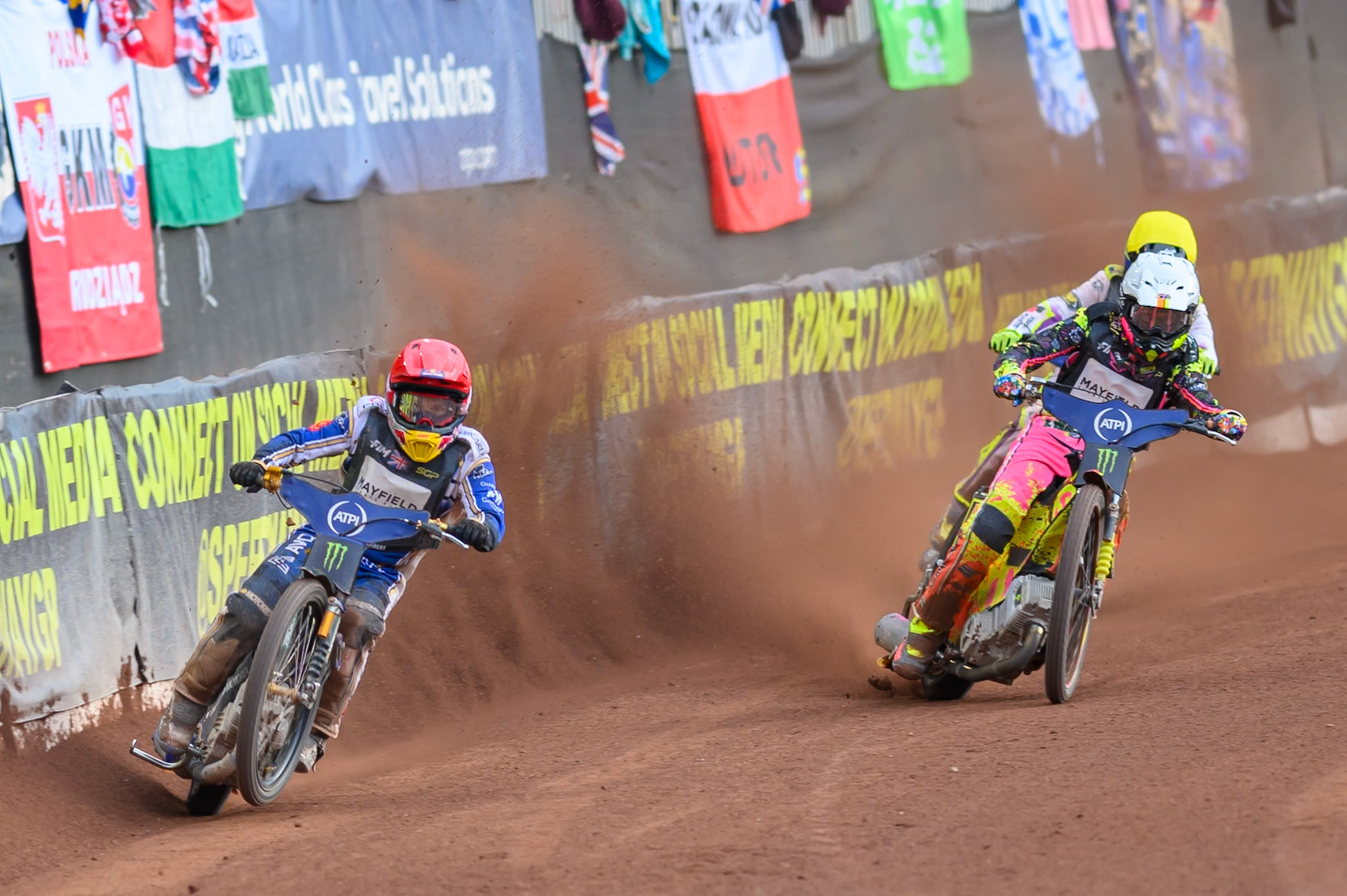 Robert Lambert (505) of Great Britain in Red leading Michael Jepsen Jensen (52) of Denmark in White and Wild Card Tom Brennan (16) of Great Britain in Yellow during the ATPI  FIM Speedway GP of Manchester at the National Speedway Stadium, Manchester on Friday 5th June 2026. (Photo: Ian Charles | MI News)