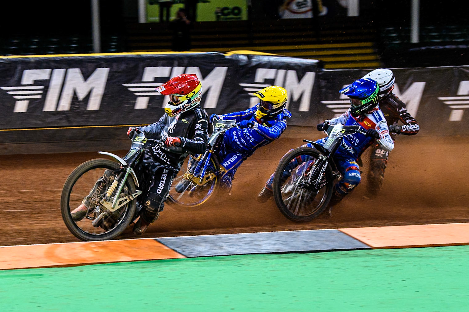 Maciej Janowski (71) of Poland leading Bartosz Zmarzlik (95) of Poland  in Yellow, Daniel Bewley (99) of Great Britain in Blue and January Kvech (201) of Czechia in White during the FIM Speedway Grand Prix of Great Britain at The Principality Stadium, Cardiff on Saturday 17th August 2024. (Photo: Ian Charles | MI News)