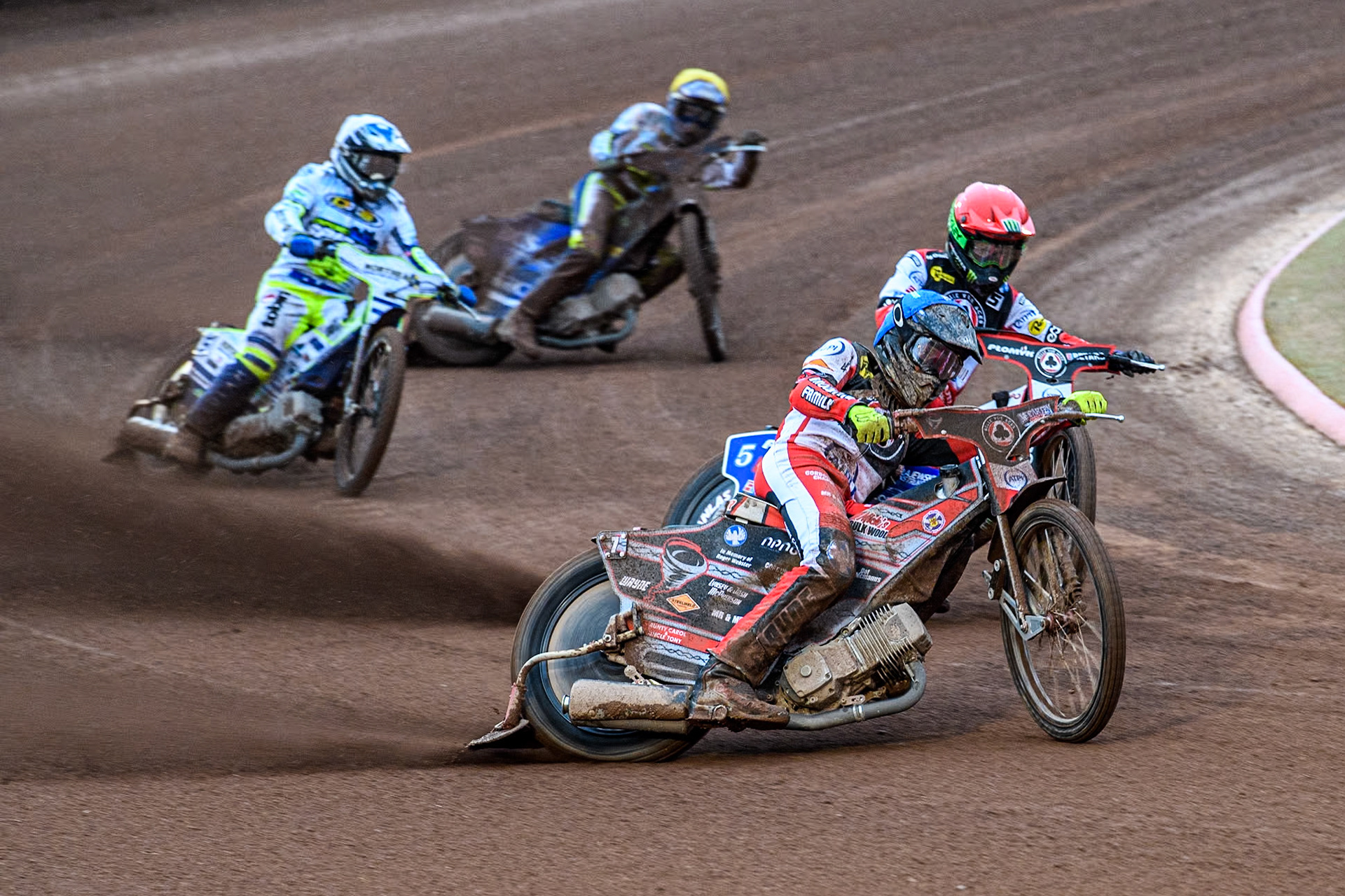 Belle Vue Aces' Connor Bailey in Blue leading team mate Belle Vue Aces' Dan Bewley in Red with Oxford Spires' Chris Harris in White and Oxford Spires' Ashton Boughen in Yellow during the Rowe Motor Oil Premiership match between Belle Vue Aces and Oxford Spires at the National Speedway Stadium, Manchester on Monday 13th May 2024. (Photo: Ian Charles | MI News)