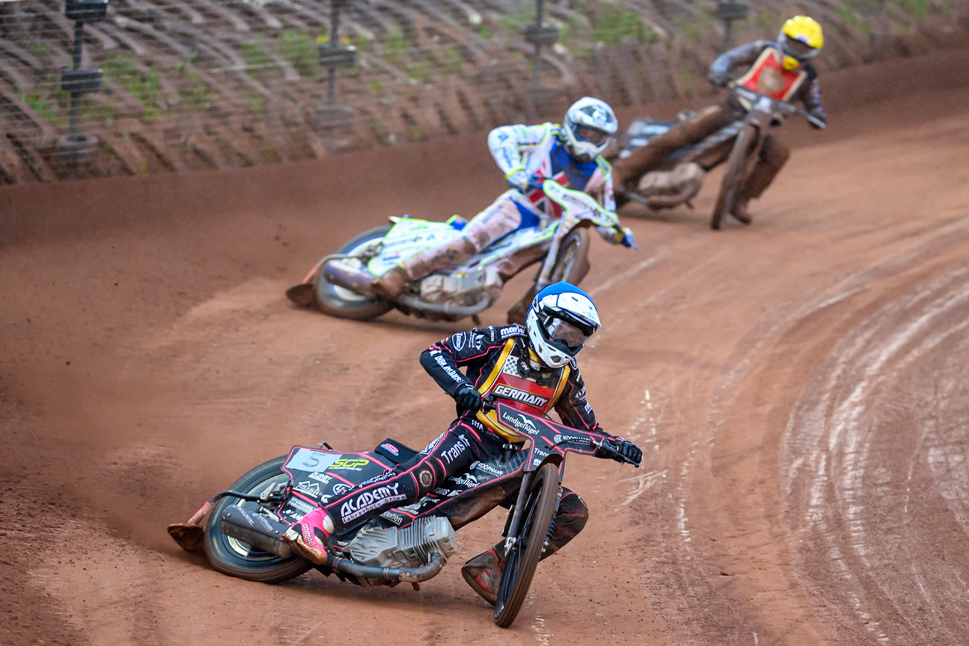 Kai Huckenbeck of Germany in Blue leading Chris Harris of Great Britain in White and Maciej Janowski of Poland in Yellow during the Speedway GP Qualifying Round 3 at Allied Ashfield Stadium, Glasgow on Saturday 30th May 2026. (Photo: Ian Charles | MI News)