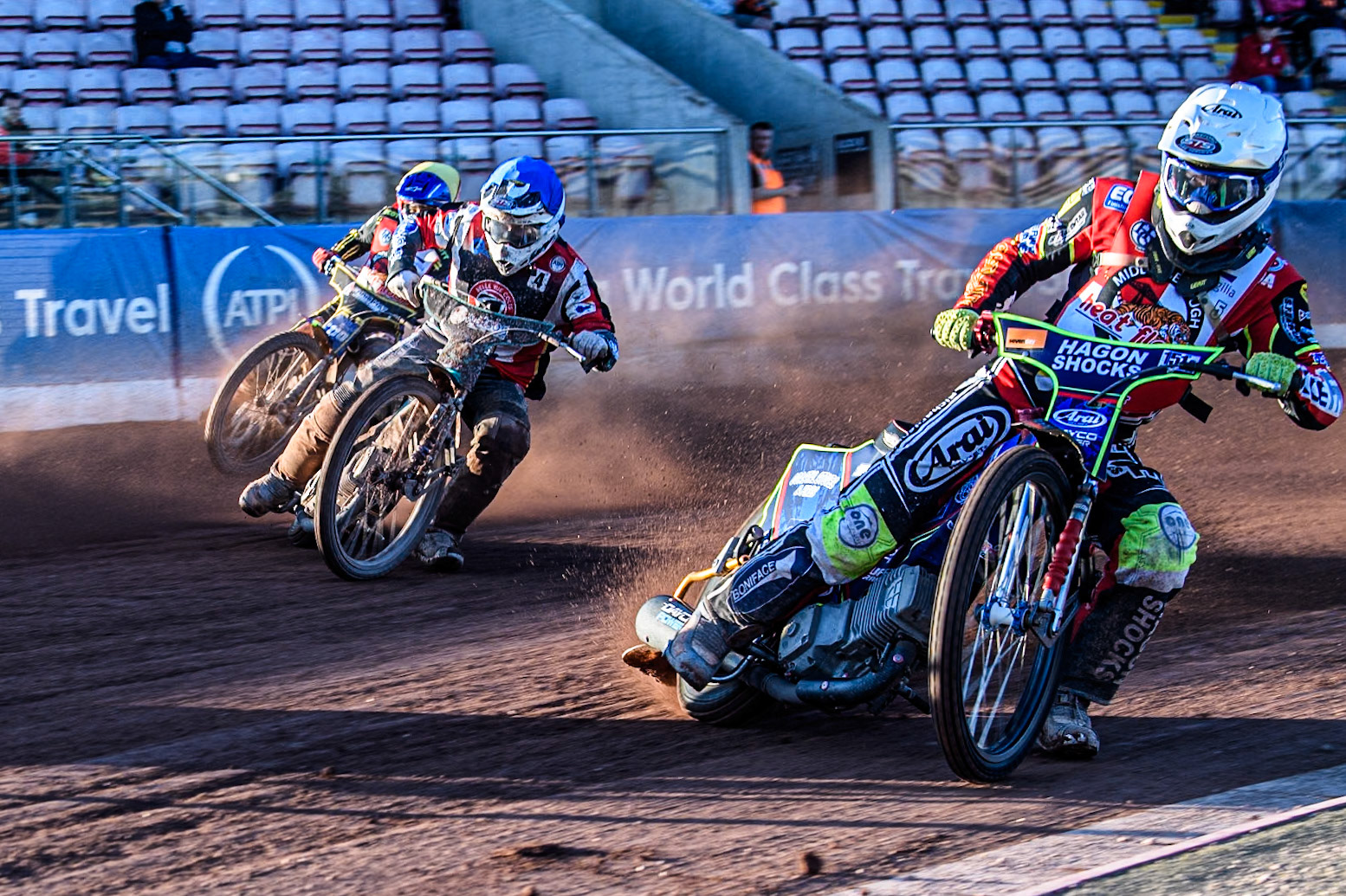 Middlesbrough Tigers' Jake Mulford in White leading Belle Vue Colts' Guest rider Mason Watson in Blue and Middlesbrough Tigers' William Hocaniuk in Yellow during the WSRA National Development League match between Belle Vue Colts and Middlesbrough Tigers at the National Speedway Stadium, Manchester on Monday 17th June 2024. (Photo: Ian Charles | MI News)