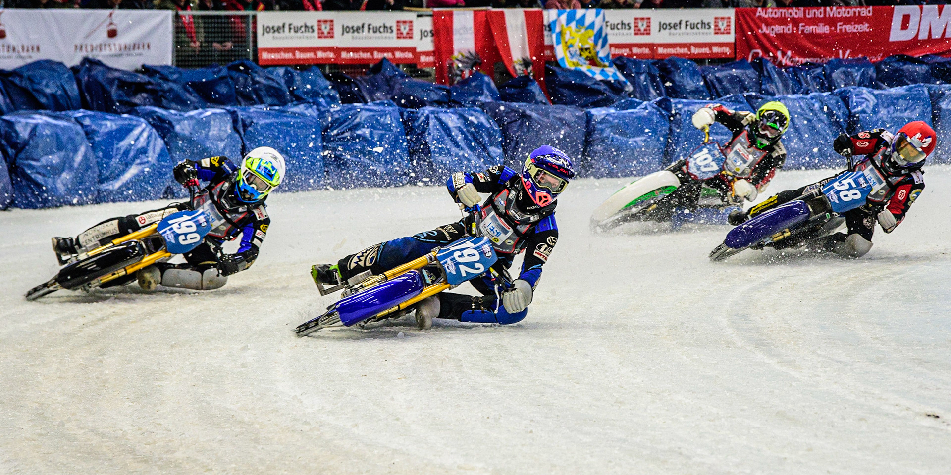 Niclas Svensson (192) (Blue) inside Martin Haarahiltunen (199) (White) with Stefan Svensson (58) (Red) and Andrej Divis (107) (Yellow) behind during the Ice Speedway Gladiators World Championship Final 2 at Max-Aicher-Arena, Inzell, Germany on Sunday 19th March 2023. (Photo: Ian Charles | MI News)