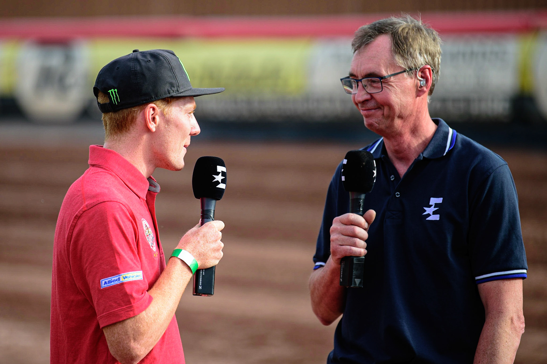 MANCHESTER UK  Eurosport commentator Kelvin Tatum  (centre) chatting with former Aces rider Dan Bewley about the track conditions during the SGB Premiership match between Belle Vue Aces and King's Lynn Stars at the National Speedway Stadium, Manchester on Monday 11th July 2022. (Credit: Ian Charles | MI News)