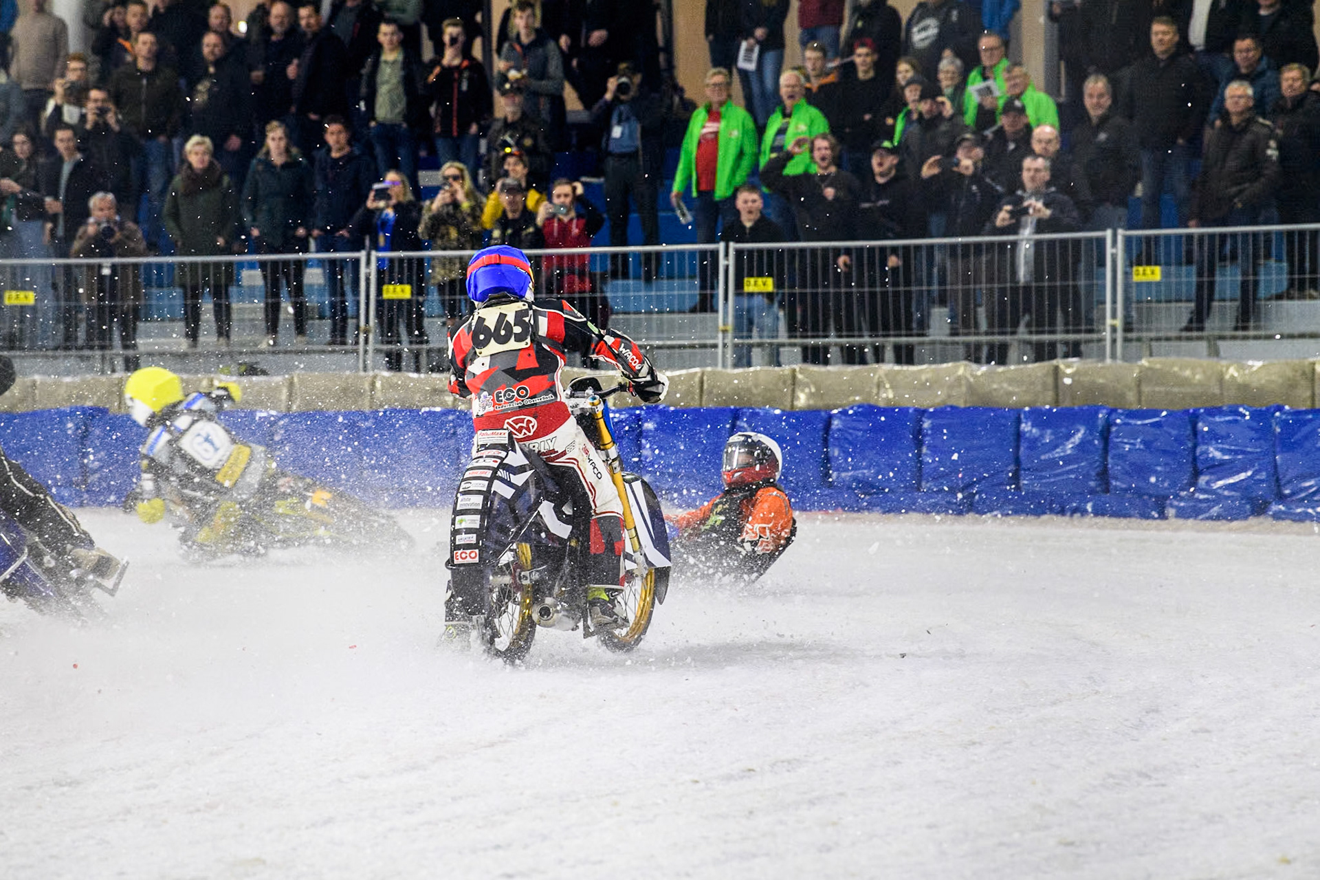 Finland's Aki Ala-Riihimäki (66) in White spins off leaving Austria's Charly Ebner (665) in Blue with nowhere to go during the FIM Ice Speedway Gladiators World Championship Final 4 at Ice Rink Thialf, Heerenveen on Sunday 7th April 2024. (Photo: Ian Charles | MI News)
