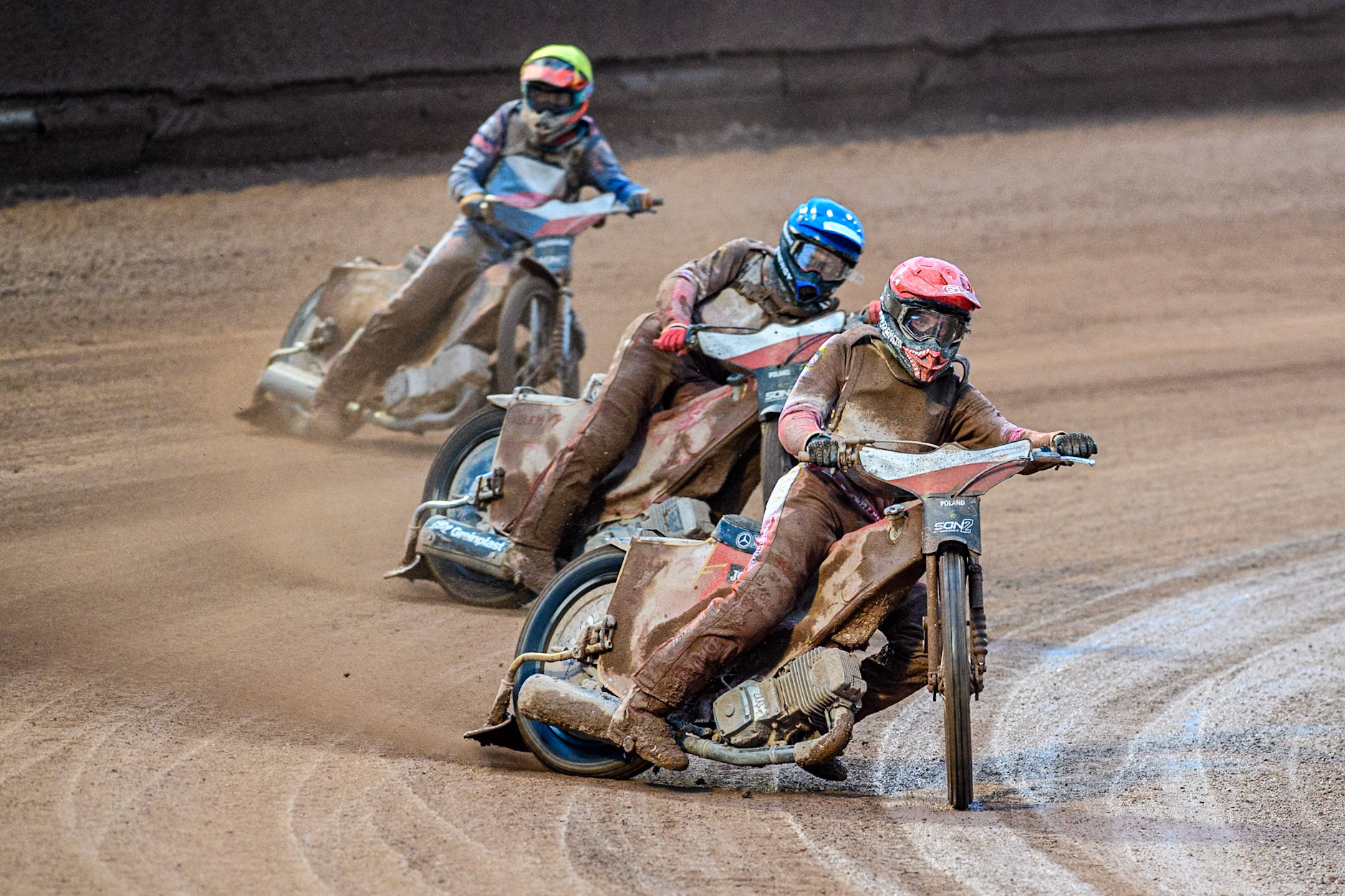 Wiktor Przyjemski of Poland in Red leading Bartosz Banbor of Poland in Blue and Matous Kamenik of Czech Republic in Yellow as the Polish riders win the heat to take the Championship during the Monster Energy FIM Speedway of Nations 2 (Under 21) Final at the National Speedway Stadium, Manchester on Friday 12th July 2024. (Photo: Ian Charles | MI News)