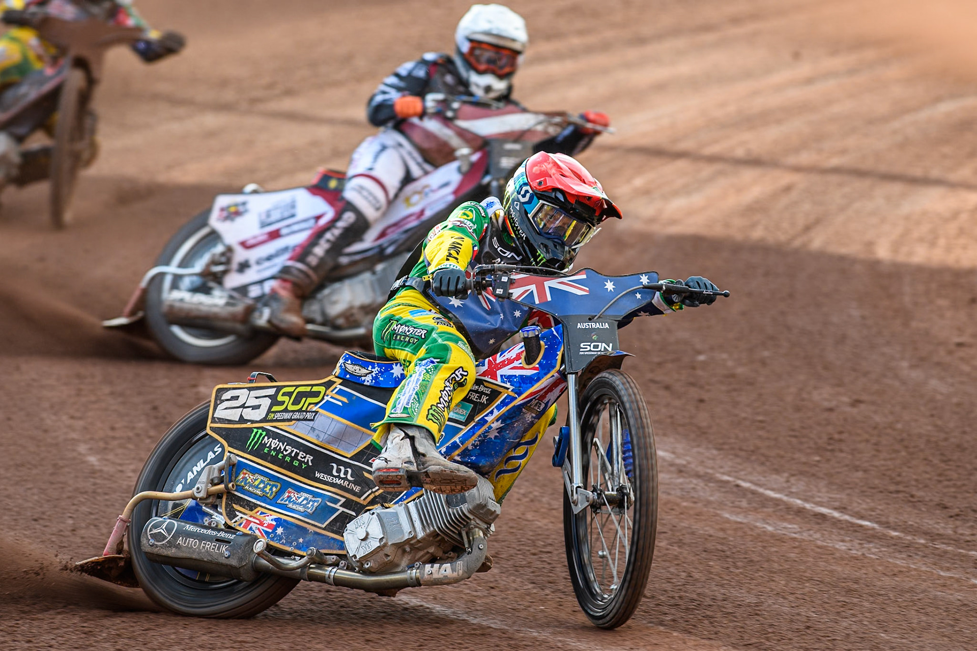 Jack Holder of Australia in Red leading Andzejs Lebedevs of Latvia in White during the Monster Energy FIM Speedway of Nation Final at the National Speedway Stadium, Manchester on Saturday 13th July 2024. (Photo: Ian Charles | MI News)