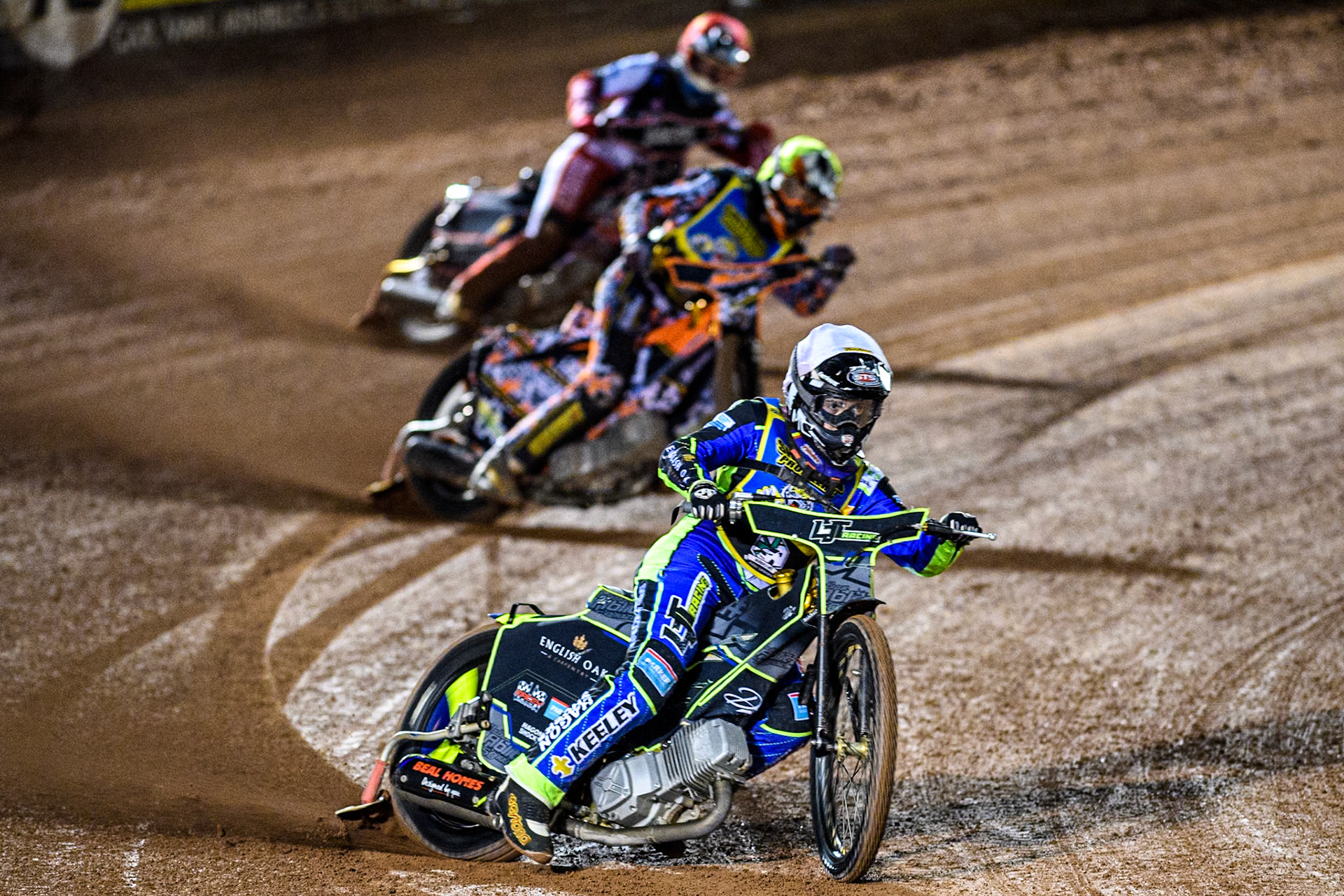 Sheffield Cubs' Nathan Ablitt in White leading Sheffield Cubs' Mickie Simpson in Yellow and Belle Vue Colts' Sam Hagon in Red during the WSRA National Development League match between Belle Vue Colts and Sheffield Tiger Cubs at the National Speedway Stadium, Manchester on Monday 7th October 2024. (Photo: Ian Charles | MI News)