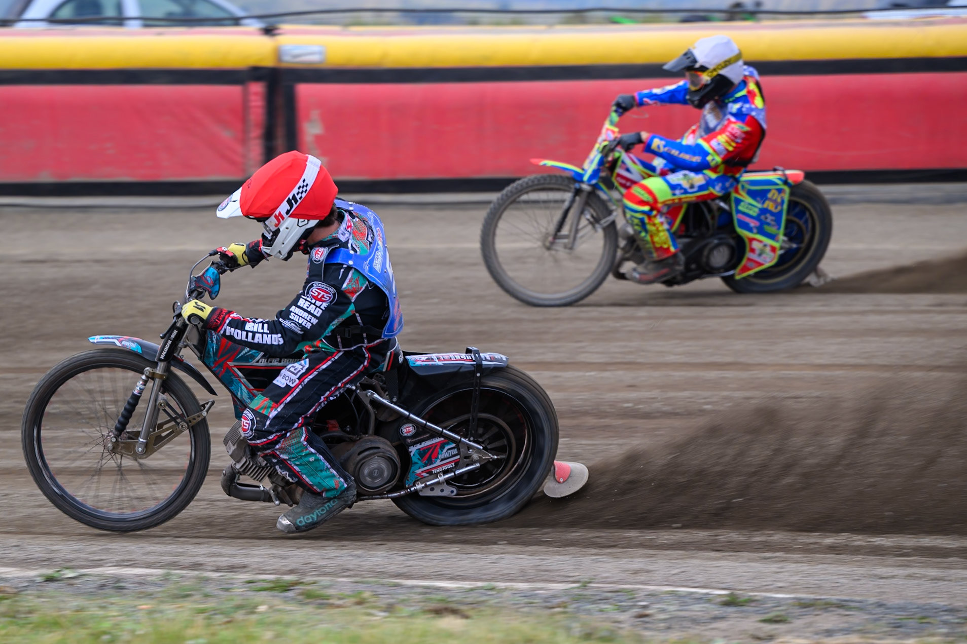 Alfie Bowtell of Buxton Bulls in Red on the inside of Simon Lambert of Kings Lynn Young Stars in White during the WSRA National Development League match between Buxton Bulls and King's Lynn Young Stars at Hi-Edge Speedway, Buxton on Sunday 9th August 2026. (Photo: Ian Charles | MI News)