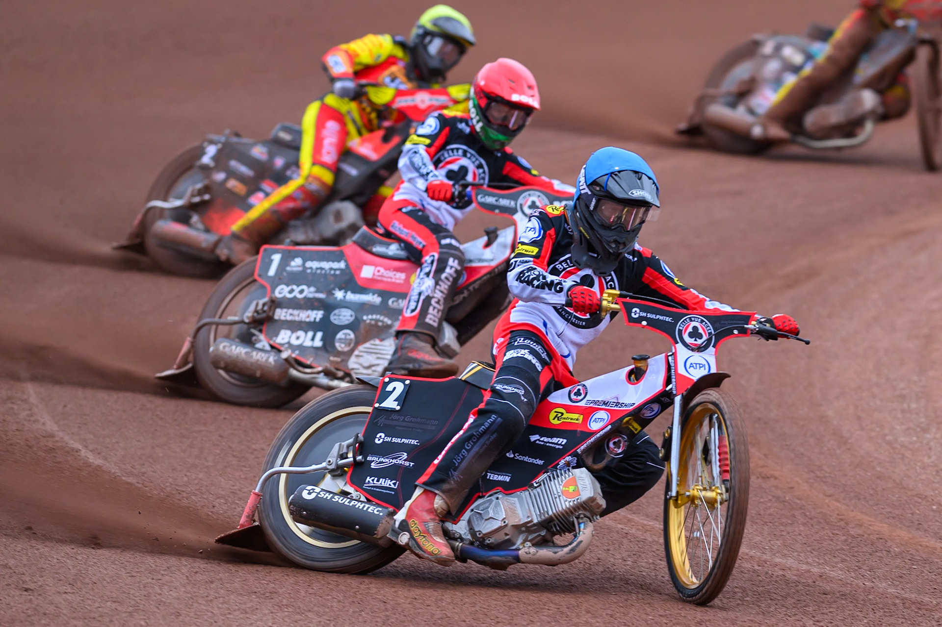 Norick Blödorn of Belle Vue Aces in Blue leading Brady Kurtz of Belle Vue Aces in Red and Dan Thompson of Leicester Lions in Yellow during the Rowe Motor Oil Premiership match between Belle Vue Aces and Leicester Lions at the National Speedway Stadium, Manchester on Monday 15th June 2026. (Photo: Ian Charles | MI News)