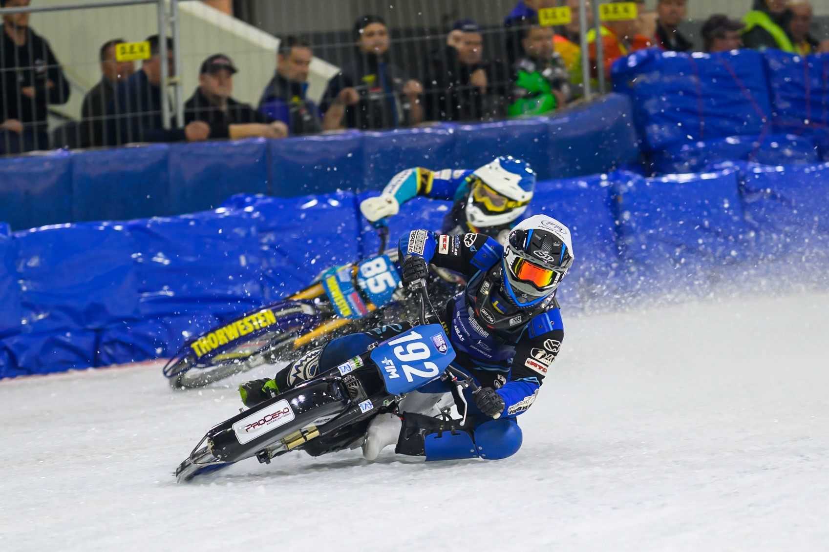 Niclas Svensson (192) of Sweden  in White rides inside Luca Bauer (85) of Italy/Germany  in Blue during the FIM Ice Speedway Gladiators World Championship Final 3 at Ice Rink Thialf, Heerenveen on Saturday 11th April 2026. (Photo: Ian Charles | MI News)