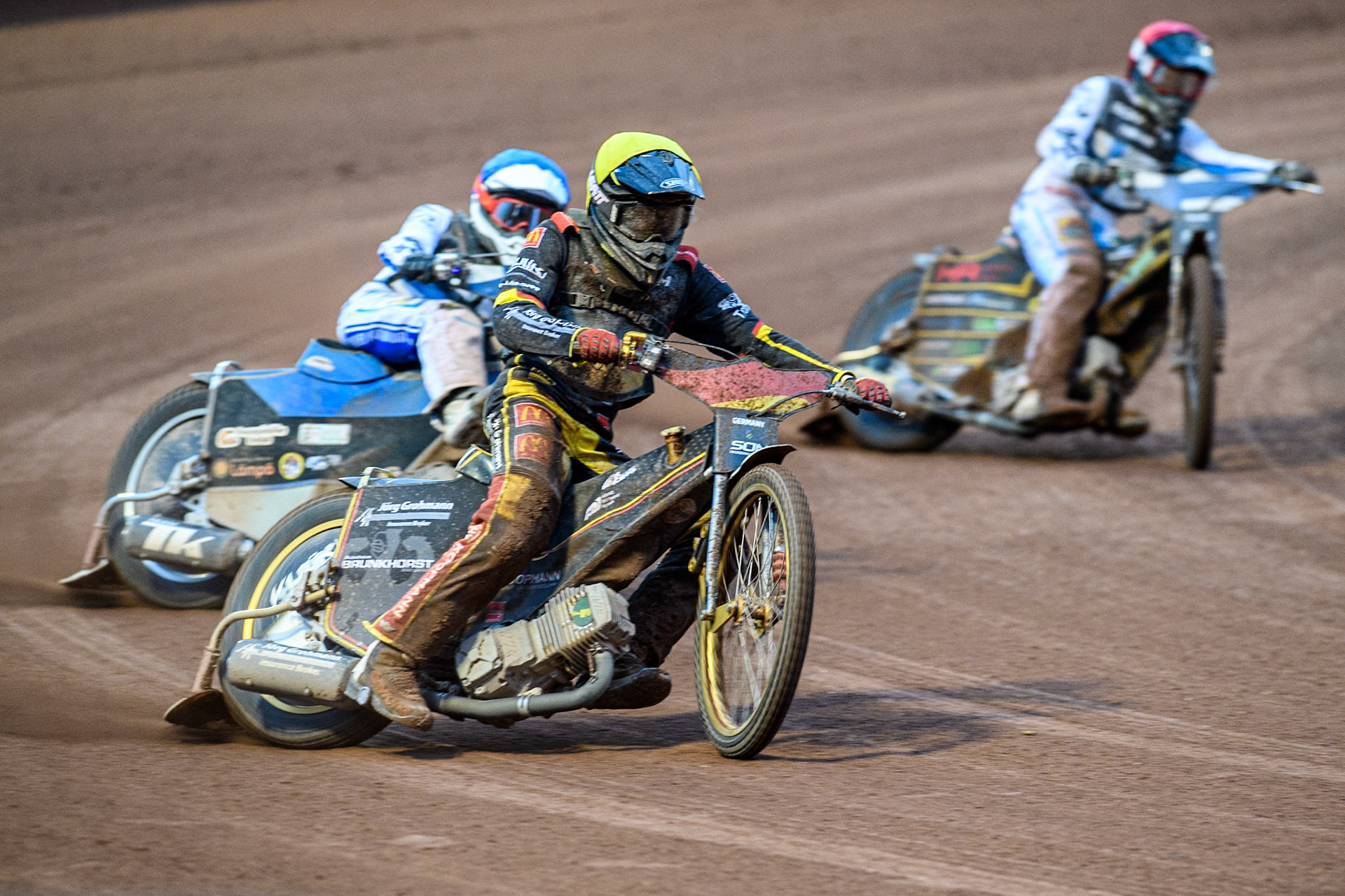 Norick Blödorn of Germany in Yellow leading Antti Vuolas of Finland in Yellow and Jesse Mustonen of Finland in White during the Monster Energy FIM Speedway of Nations Semi-Final 1 at the National Speedway Stadium, Manchester on Tuesday 9th July 2024. (Photo: Ian Charles | MI News)