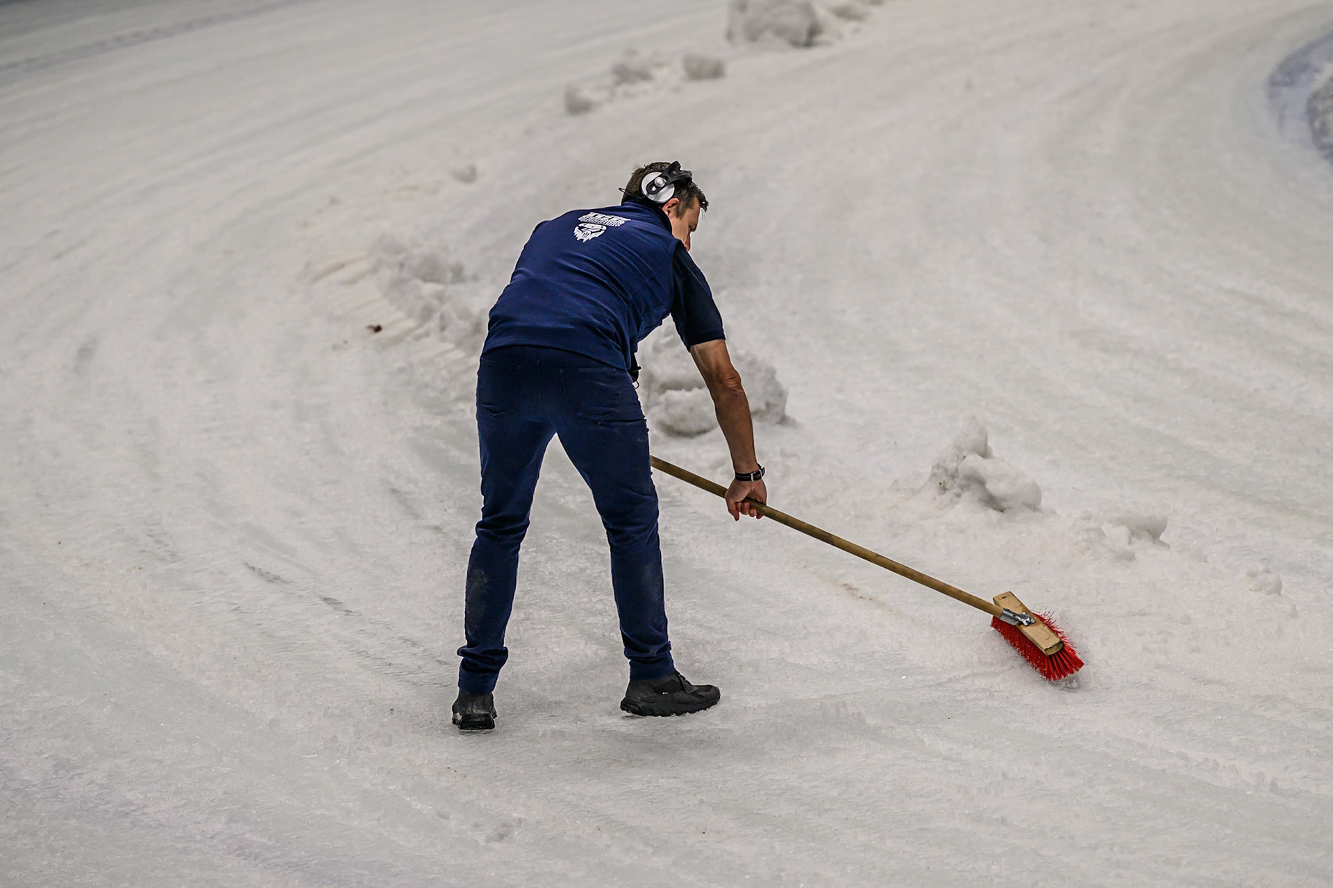 Race Director Phil Morris does some brushing of the ice on the track during the Ice Speedway Gladiators World Championship Final 1 at Max-Aicher-Arena, Inzell on Saturday 14th March 2026. (Photo: Ian Charles | MI News)
