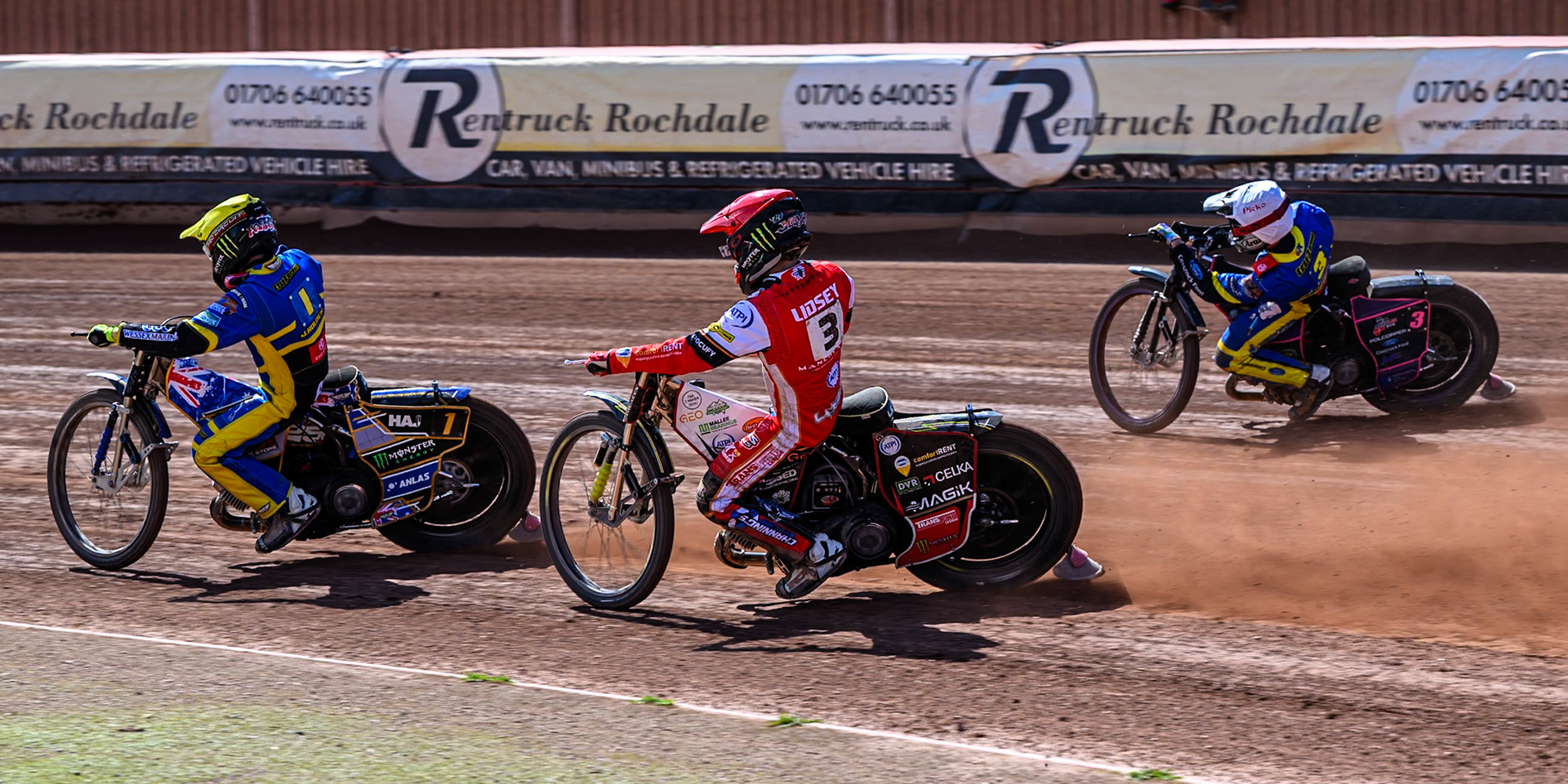 Jaimon Lidsey of Belle Vue Aces in Red rides inside Josh Pickering of Sheffield Tigers  in White whilst chasing Jack Holder of Sheffield Tigers  in Yellow during the Rowe Motor Oil Premiership match between Belle Vue Aces and Sheffield Tigers at the National Speedway Stadium, Manchester on Monday 25th August 2025. (Photo: Ian Charles | MI News)