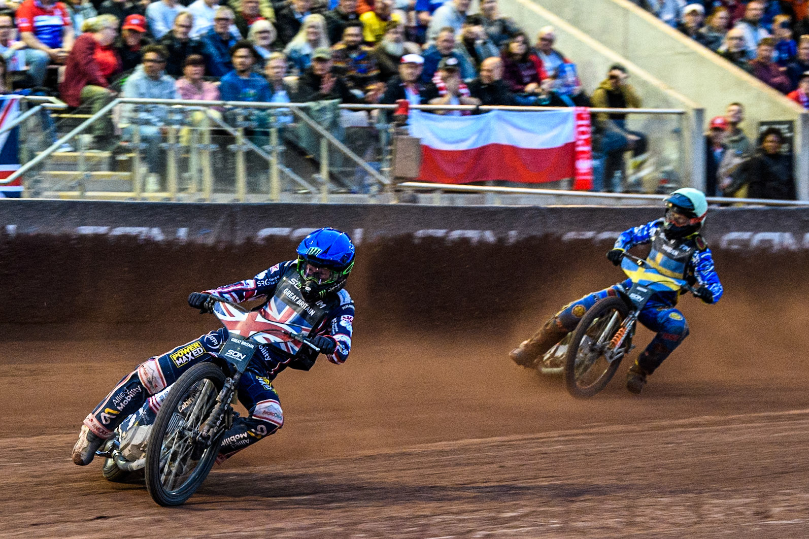 Dan Bewley of Great Britain in Blue leading Jacob Thorssell of Sweden in Yellow during the Monster Energy FIM Speedway of Nation Final at the National Speedway Stadium, Manchester on Saturday 13th July 2024. (Photo: Ian Charles | MI News)