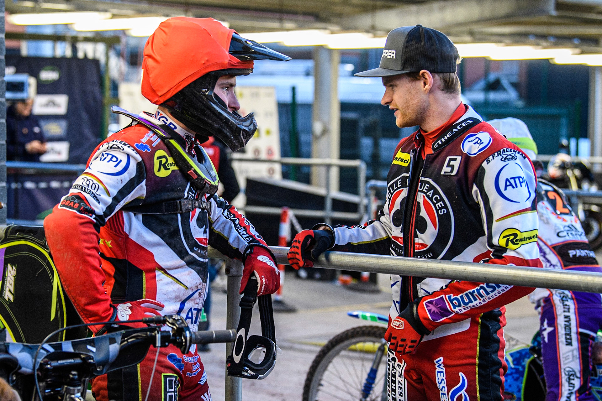 Brady Kurtz  (right) passes on some advice to team mate Tom Brennan  during the SGB Premiership match between Belle Vue Aces and Peterborough at the National Speedway Stadium, Manchester on Monday 24th April 2023. (Photo: Ian Charles | MI News)