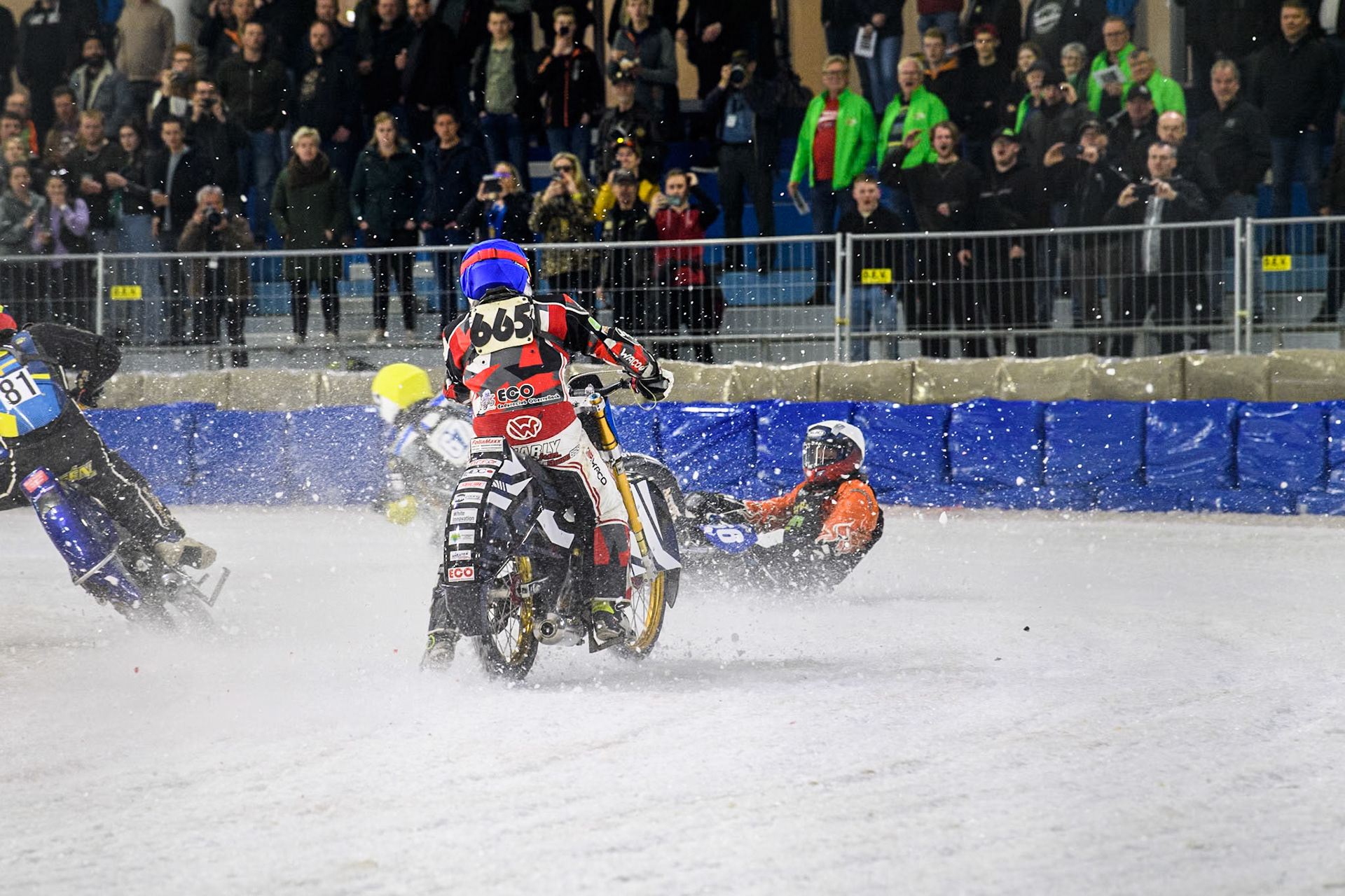 Finland's Aki Ala-Riihimäki (66) in White spins off leaving Austria's Charly Ebner (665) in Blue with nowhere to go during the FIM Ice Speedway Gladiators World Championship Final 4 at Ice Rink Thialf, Heerenveen on Sunday 7th April 2024. (Photo: Ian Charles | MI News)