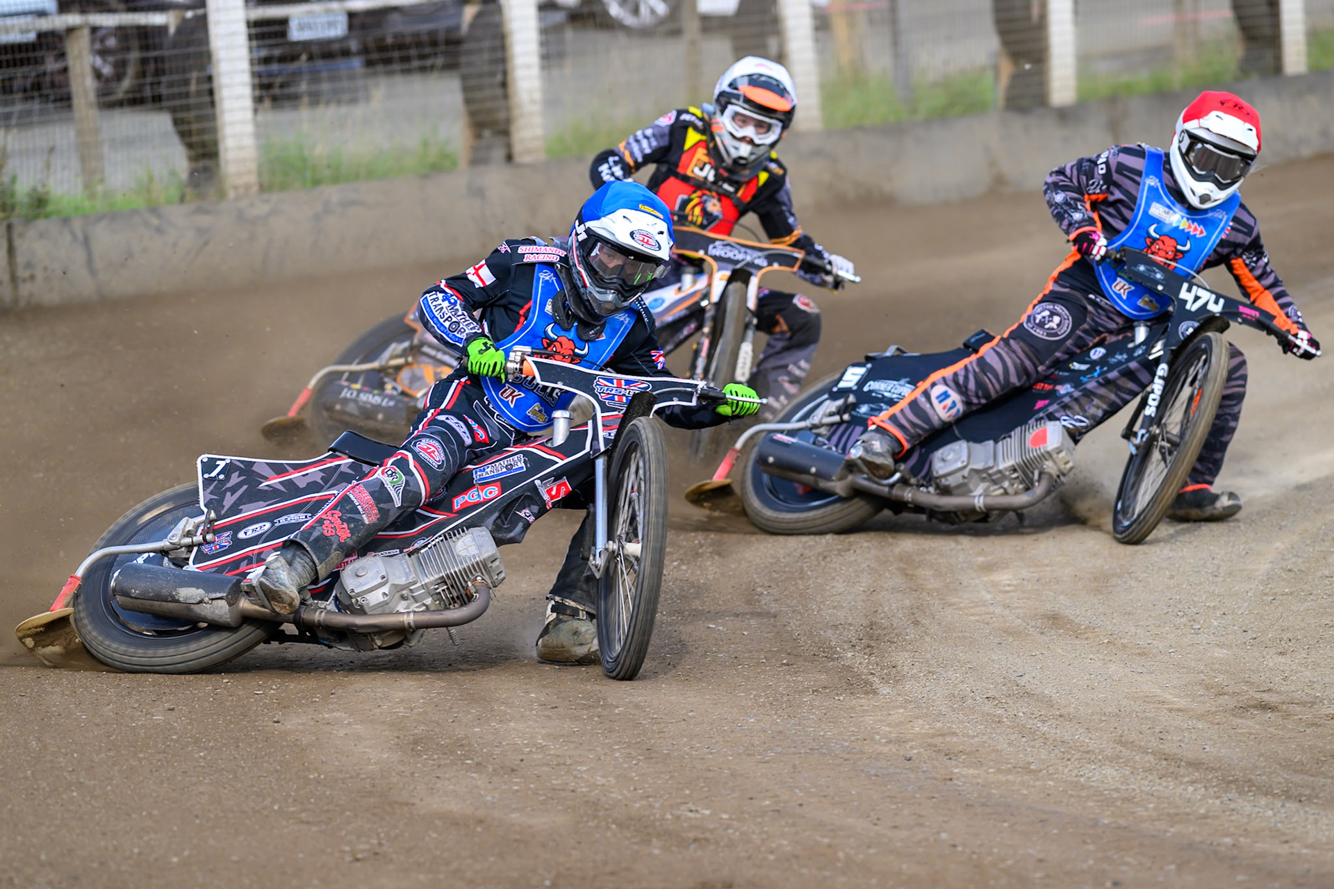 Jack Shimelt of Buxton Bulls  in Blue leading Jack Roberts of Buxton Bulls   in Red  and Ryan Ingram of Leicester Lion Cubs   in White during the WSRA National Development League match between Buxton Bulls and Leicester Lion Cubs at Hi-Edge Speedway, Buxton on Sunday 4th October 2026. (Photo: Ian Charles | MI News)