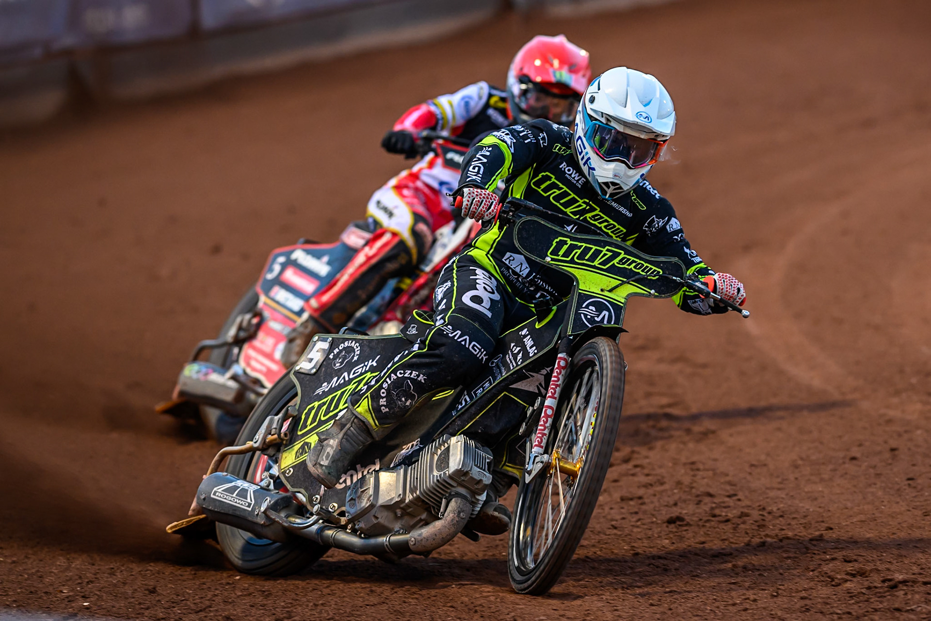 Emil Sayfutdinov of Ipswich Witches  in White leading Dan Bewley of Belle Vue Aces  in Red during the Rowe Motor Oil Premiership match between Belle Vue Aces and Ipswich Witches at the National Speedway Stadium, Manchester on Monday 4th August 2025. (Photo: Ian Charles | MI News)