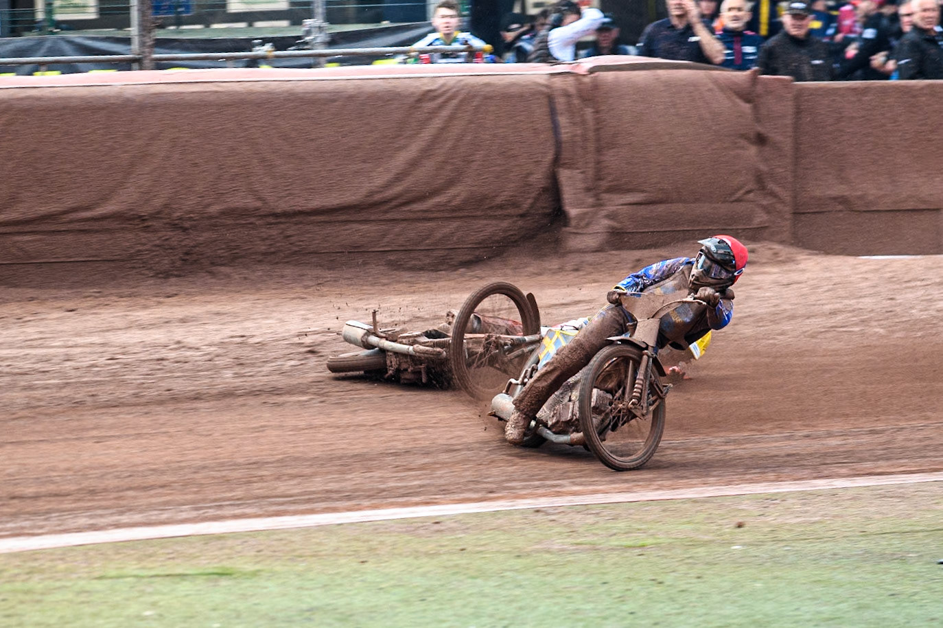 Bartosz Banbor of Poland falls behind Philip Hellström-Bängs of Sweden in Red during the Monster Energy FIM Speedway of Nations 2 (Under 21) Final at the National Speedway Stadium, Manchester on Friday 12th July 2024. (Photo: Ian Charles | MI News)