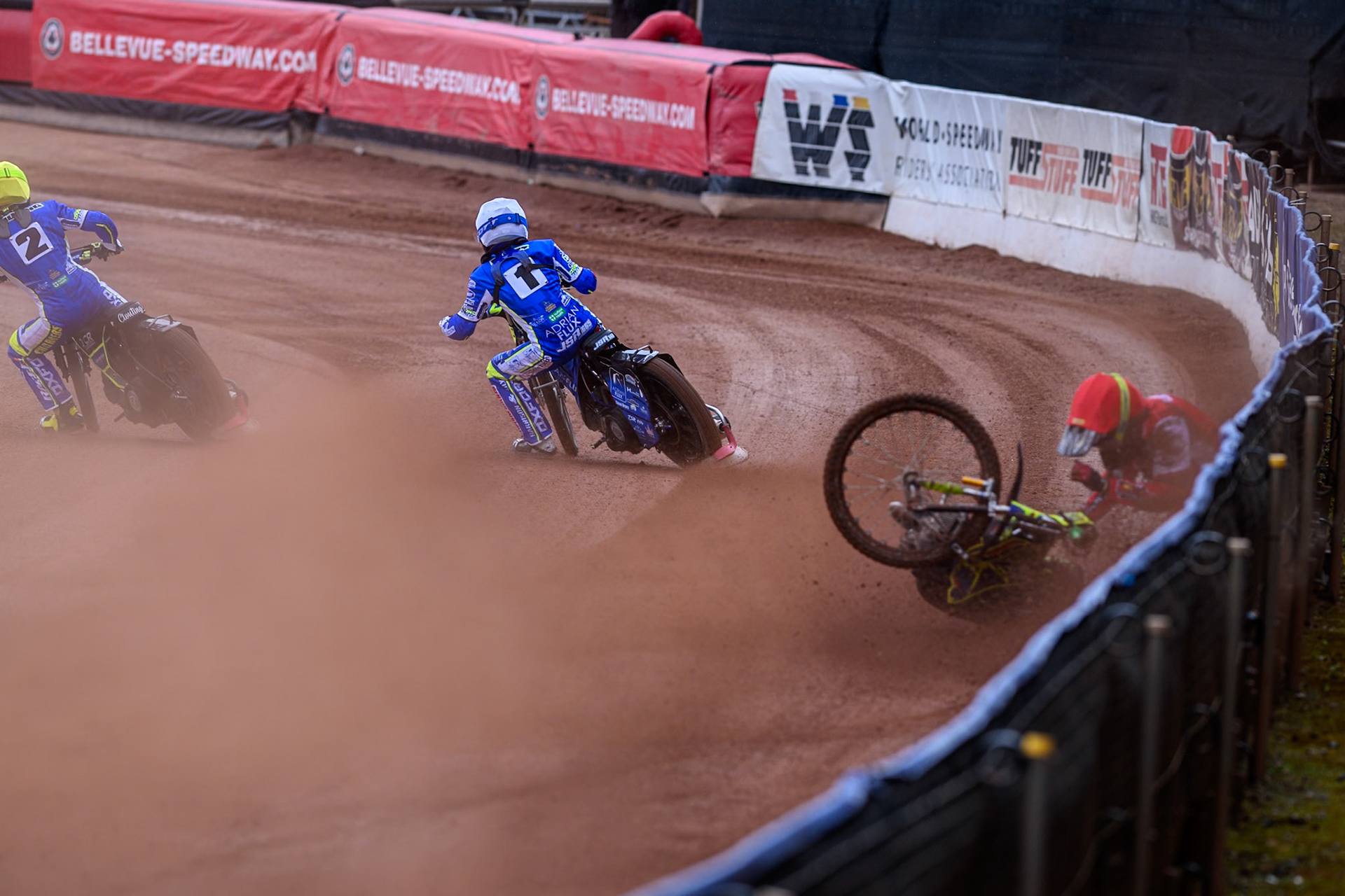 Belle Vue Colts' William Cairns falls whilst trying to pass Oxford Chargers' Jody Scott  in White and Oxford Chargers' Jacob Clouting  in Yellow during the WSRA National Development League match between Belle Vue Colts and Oxford Chargers at the National Speedway Stadium, Manchester on Sunday 1st June 2025. (Photo: Ian Charles | MI News)