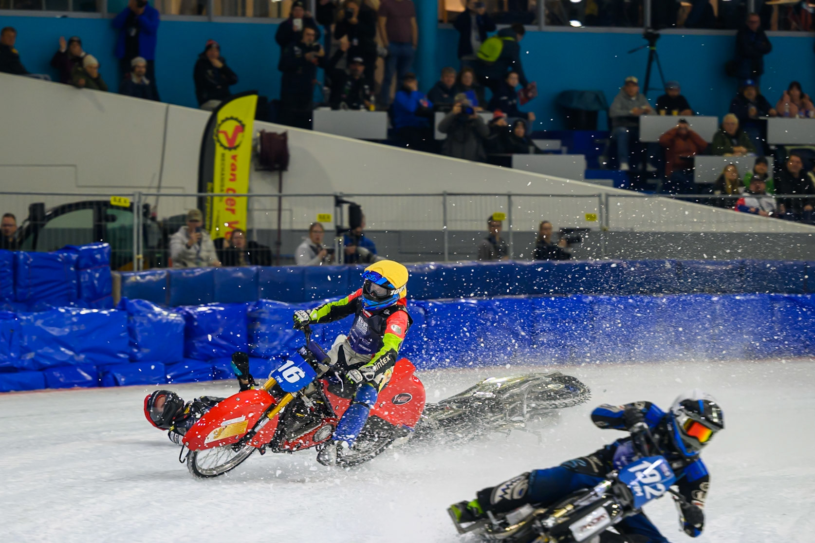 Heikki Huusko (67) of Finland  collides with Wild Card Harald Simon (16) of Austria in Yellow in the first turn during the FIM Ice Speedway Gladiators World Championship Final 3 at Ice Rink Thialf, Heerenveen on Saturday 11th April 2026. (Photo: Ian Charles | MI News)