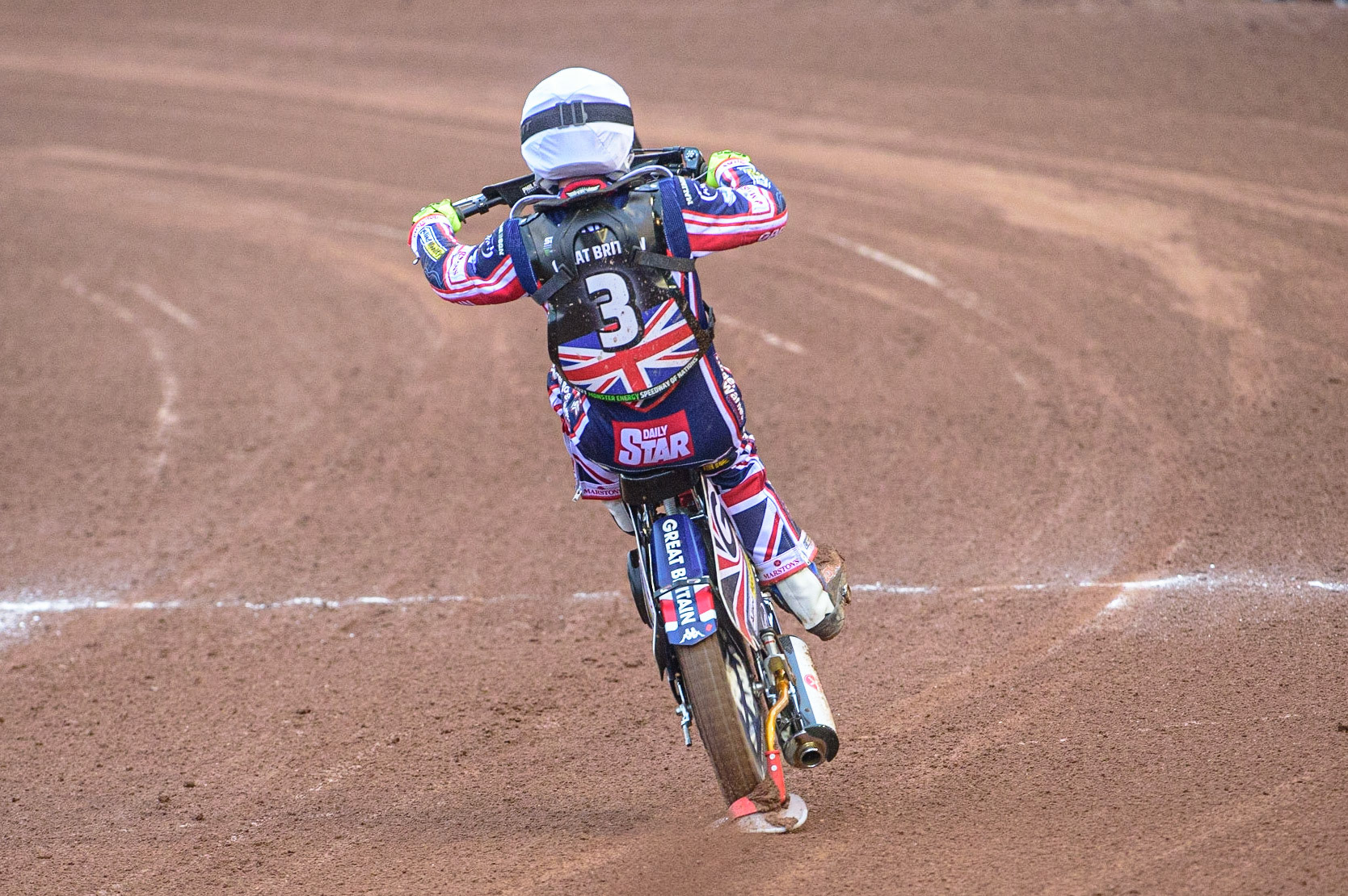 MANCHESTER, UK. OCT 17TH Tom Brennan of Great Britain celebrates with a wheelie during the Monster Energy FIM Speedway of Nations at the National Speedway Stadium, Manchester on Sunday  17th October 2021. (Credit: Ian Charles | MI News)