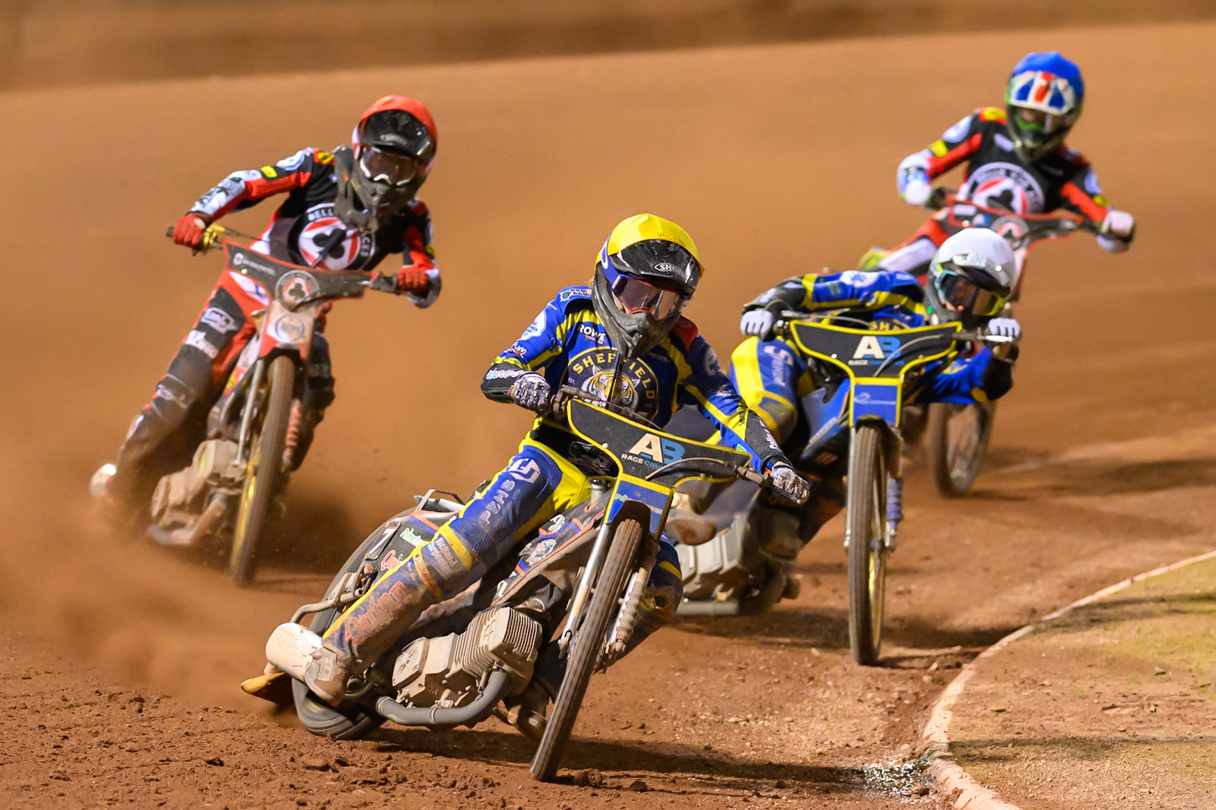 Luke Killeen of Sheffield Tigers in Yellow leading Anders Rowe of Sheffield Tigers in White , Norick Blödorn of Belle Vue Aces in Red  and William Cairns of Belle Vue Aces in Blue during the Rowe Motor Oil Premiership match between Belle Vue Aces and Sheffield Tigers at the National Speedway Stadium, Manchester on Monday 14th September 2026. (Photo: Ian Charles | MI News)