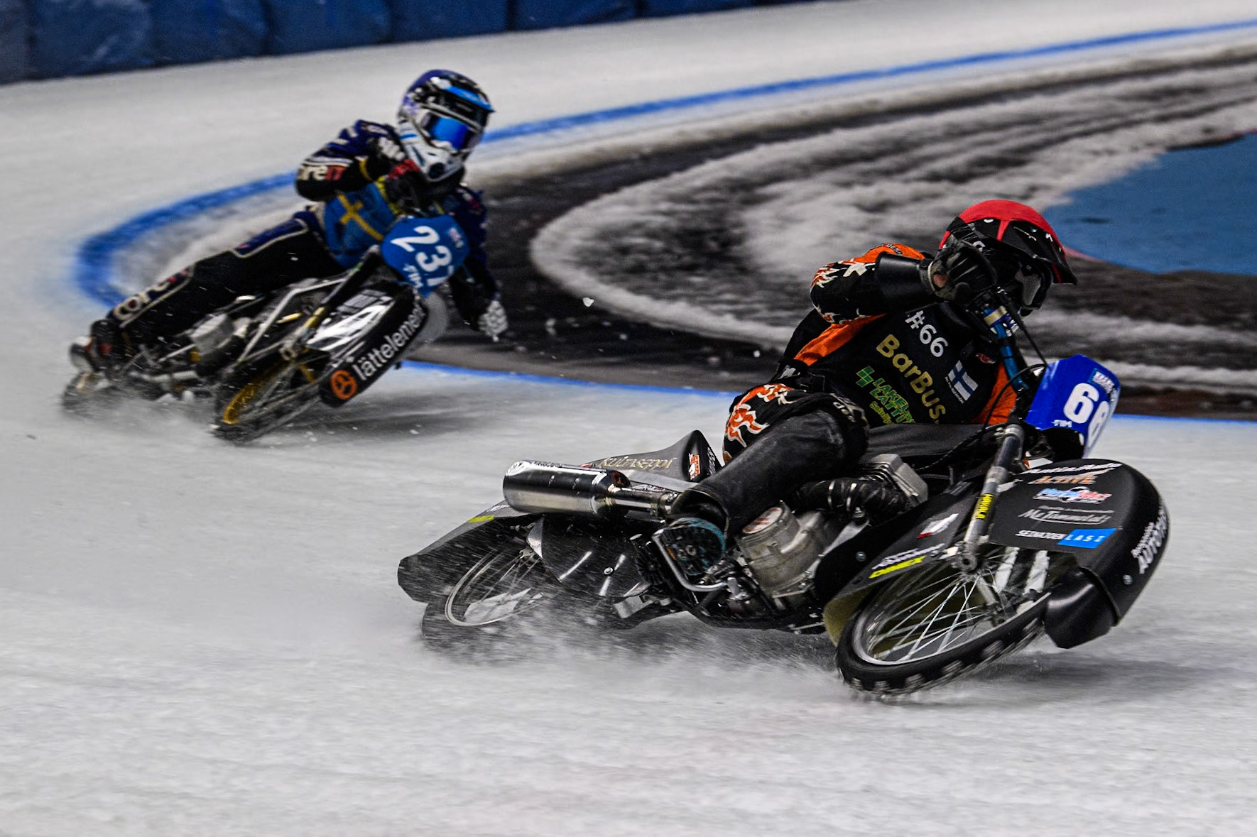 Finland's Aki Ala-Riihimäki (66) (Red) leads  Sweden's Jimmy Hörnell Lidfalk (237) (Blue) during the FIM Ice Speedway Gladiators World Championship Final 1 at the Max-Aicher-Arena, Inzell on Saturday 23 March 2024. (Photo: Ian Charles | MI News)