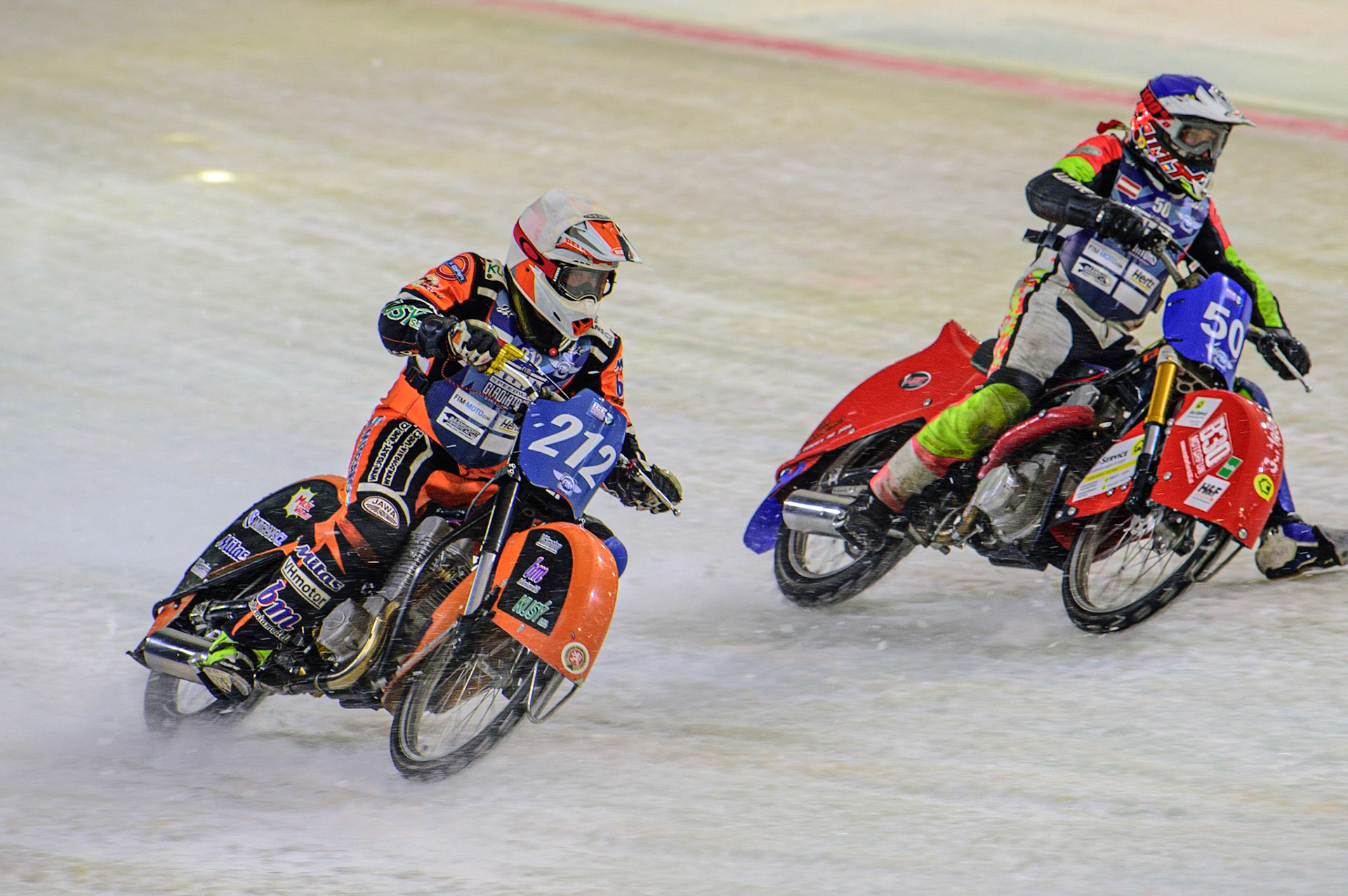HEERENVEEN, NL. Harald Simon (50) (Blue) inside Lukas Hutla (212) (White)  during the FIM Ice Speedway Gladiators World Championship Final 4 at Ice Rink Thialf, Heerenveen on Sunday  3 April 2022. (Credit: Ian Charles | MI News)