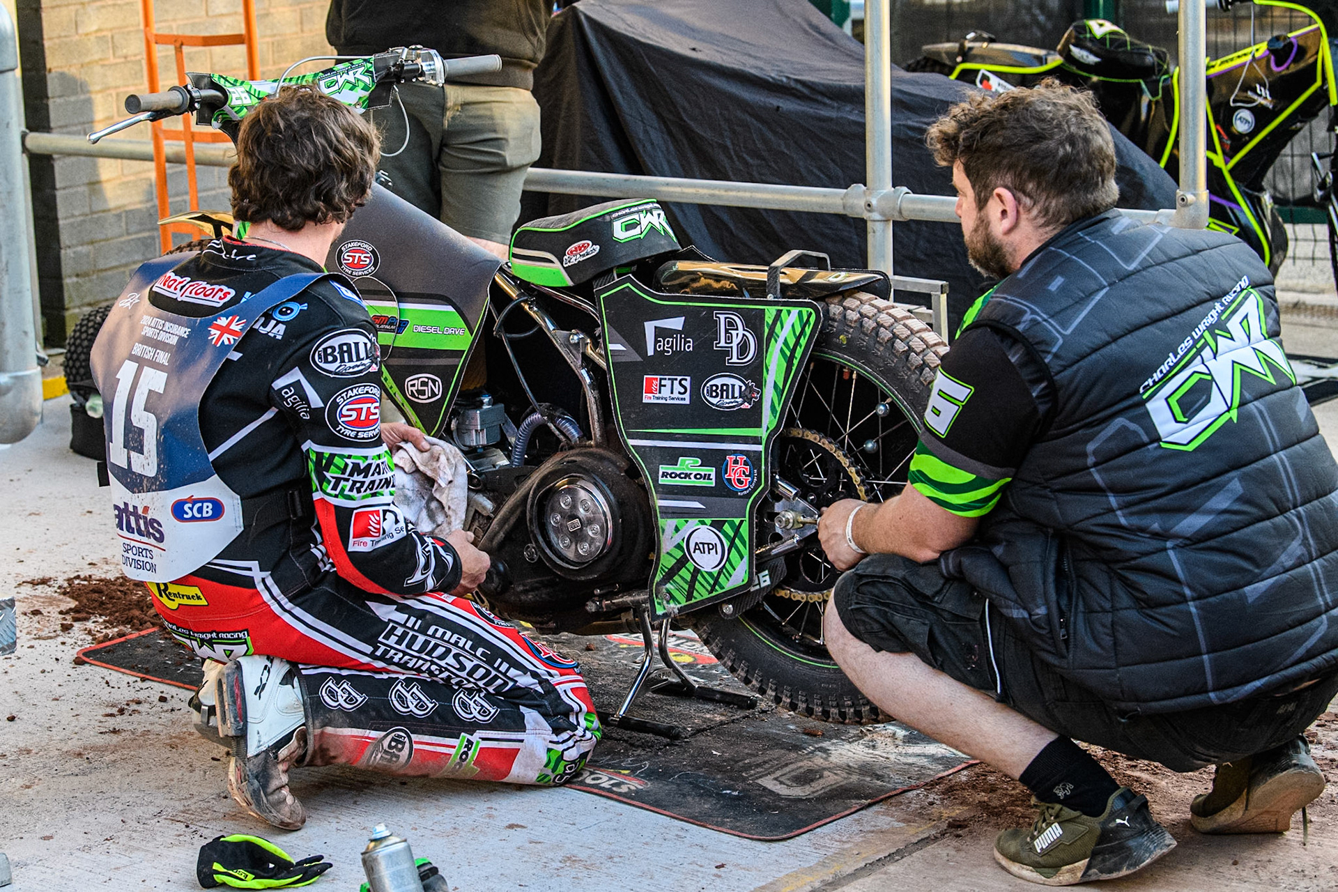 Charles Wright (Left) works on his machine during the Attis Insurance Sports Division British Speedway Championship Final at the National Speedway Stadium, Manchester on Saturday 8th June 2024. (Photo: Ian Charles | MI News)