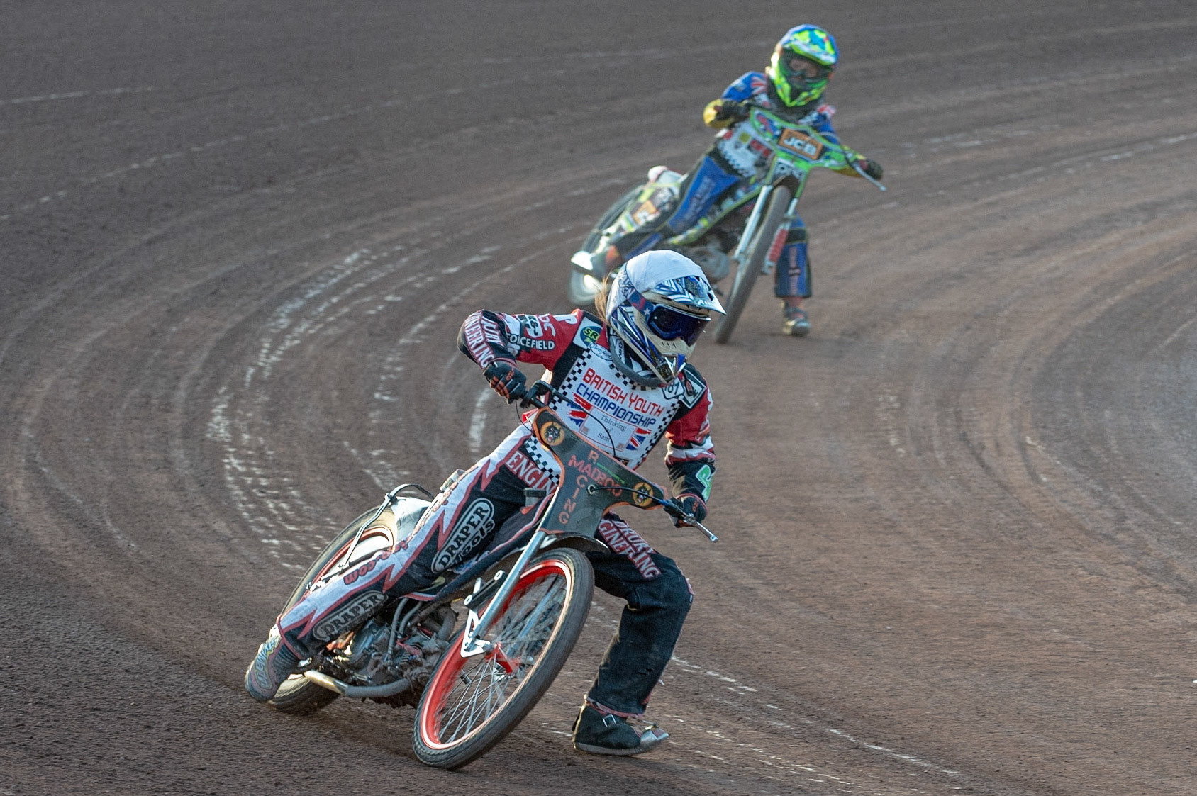 Photo: Ian Charles

Maddy Fellows  (White) leads William Hokaniuk (Blue)

Summer Speed Saturday & British Youth Speedway Championship Round 5, National Speedway Stadium, Manchester, Saturday 22 June 2019