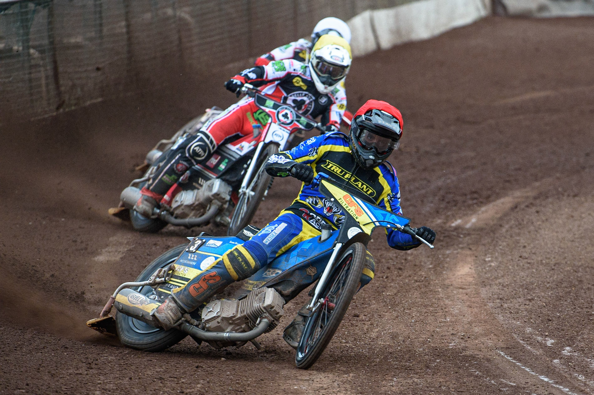 SHEFFIELD, UK. JULY 1ST     Adam Ellis  (Red) leads Richie Worrall  (Yellow) and Brady Kurtz  (White) during the SGB Premiership match between Sheffield Tigers and Belle Vue Aces at Owlerton Stadium, Sheffield on Thursday 1st July 2021. (Credit: Ian Charles | MI News)