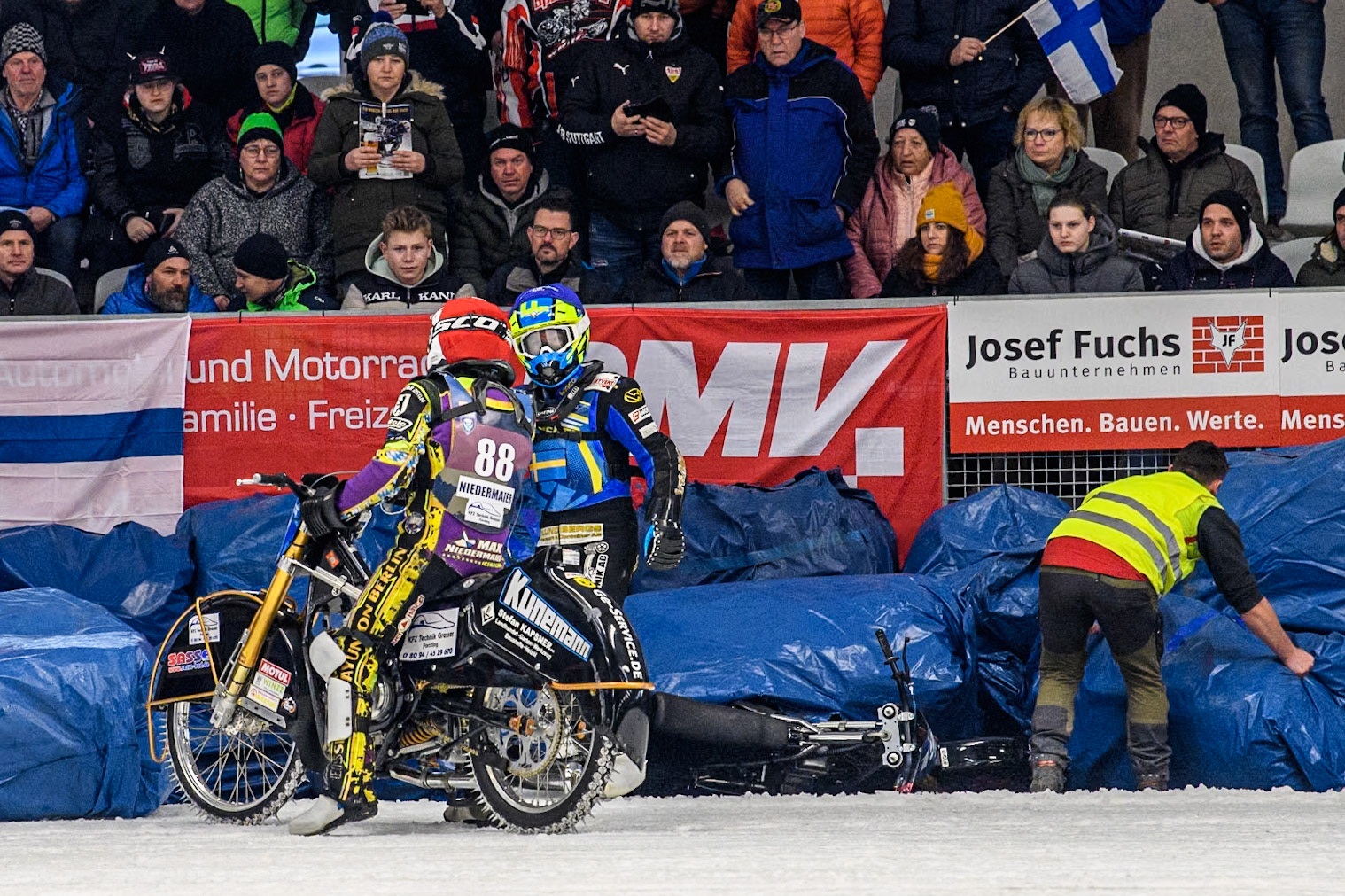 Sweden's Martin Haarahiltunen (199)  (Blue) remonstrates with Germany's Max Niedermaier (88) (Red) after he believed Niedermaier had forced him off during the FIM Ice Speedway Gladiators World Championship Final 2 at the Max-Aicher-Arena, Inzell on Sunday 24 March 2024. (Photo: Ian Charles | MI News))